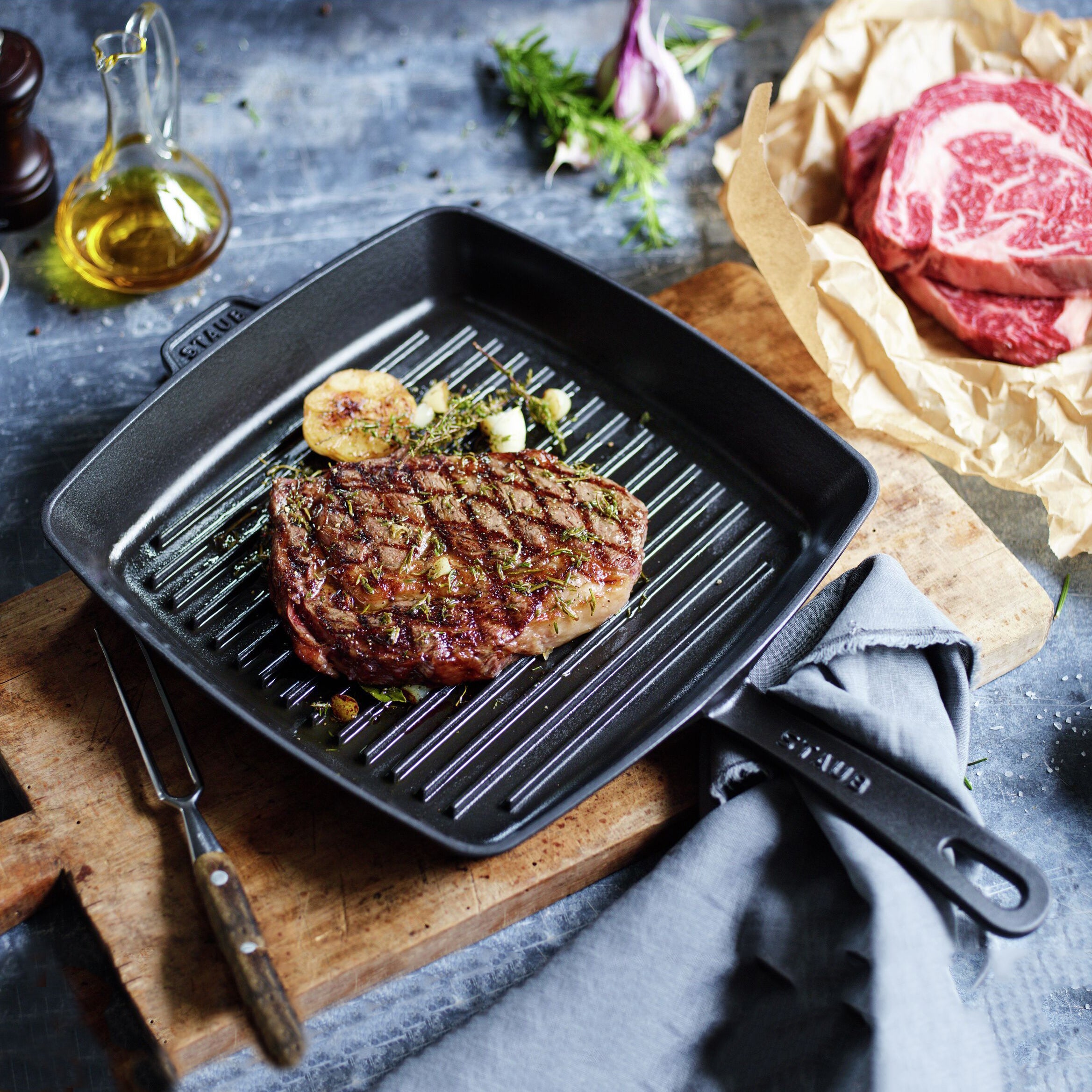 Enameled cast iron grill pan on induction cooktop showing heat distribution
