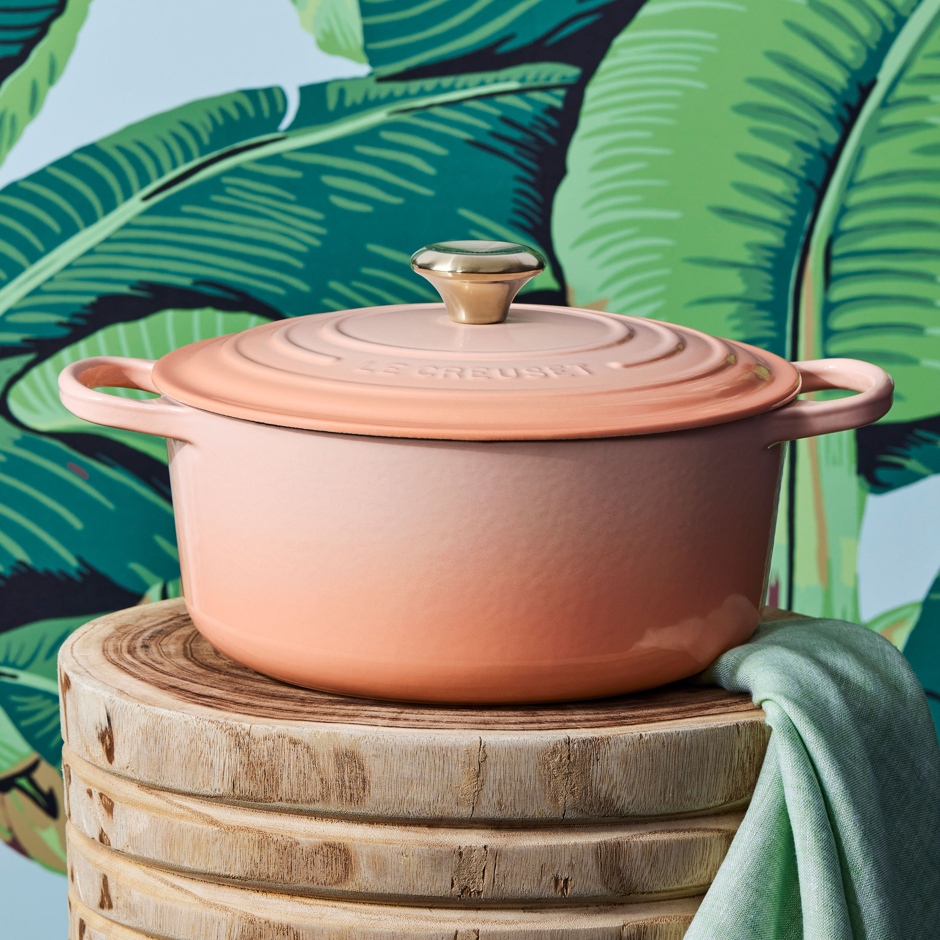 Close-up of ergonomic handles and stainless steel knob on Le Creuset Dutch oven for easy lifting