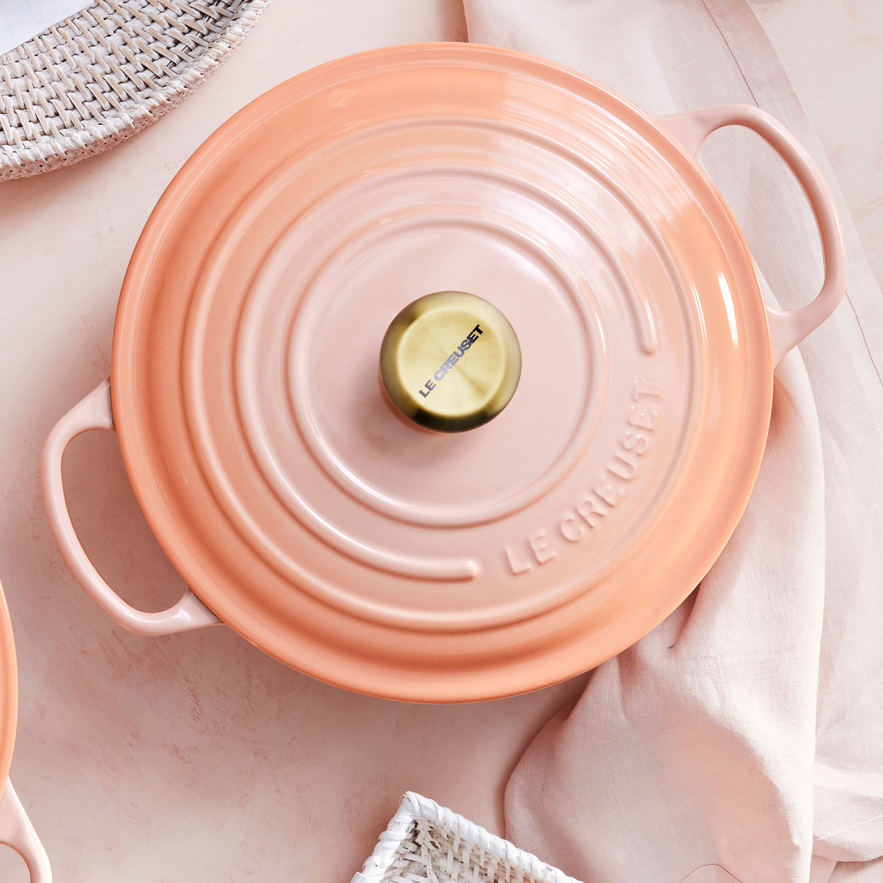 Enameled Dutch oven with lid on stovetop, showcasing heat distribution and enamel finish