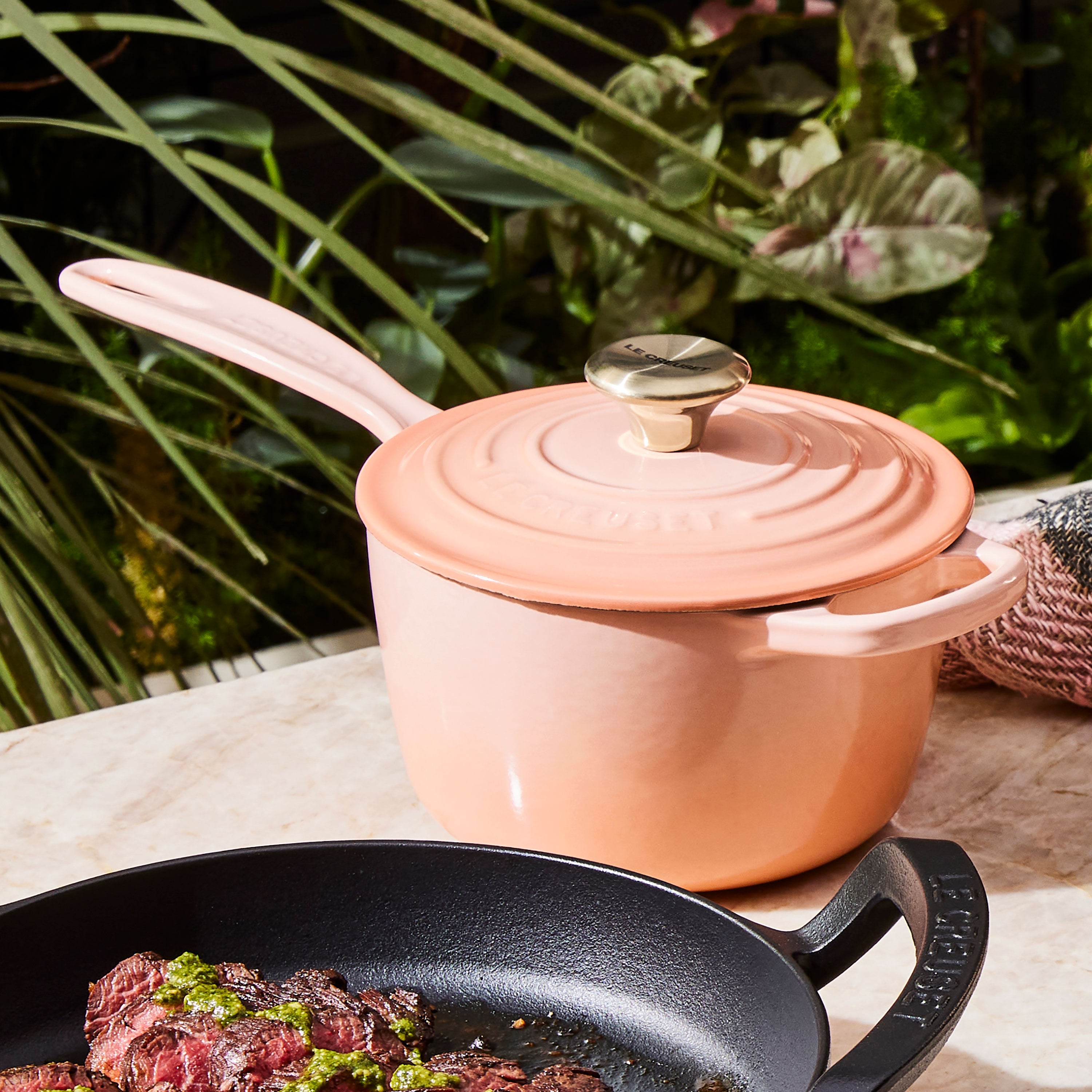 Enameled saucepan used for making sauces on induction cooktop, highlighting even heat distribution.