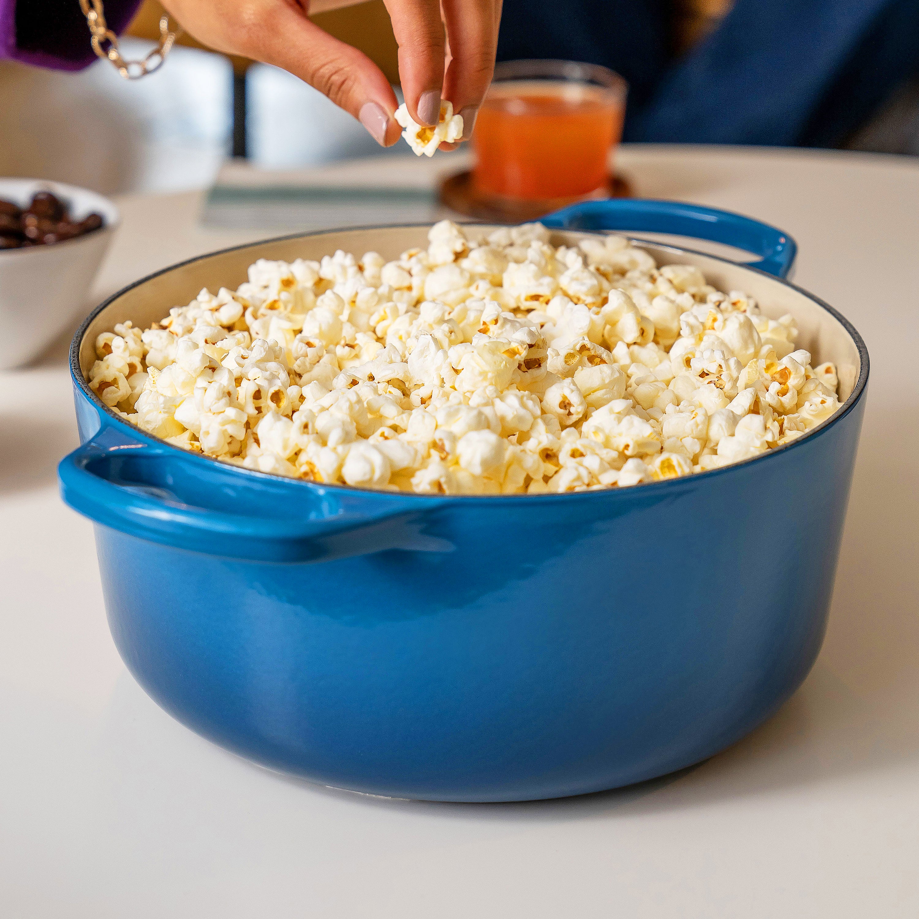 Le Creuset cast iron cookware in use for slow-cooking stew, emphasizing durability and versatility