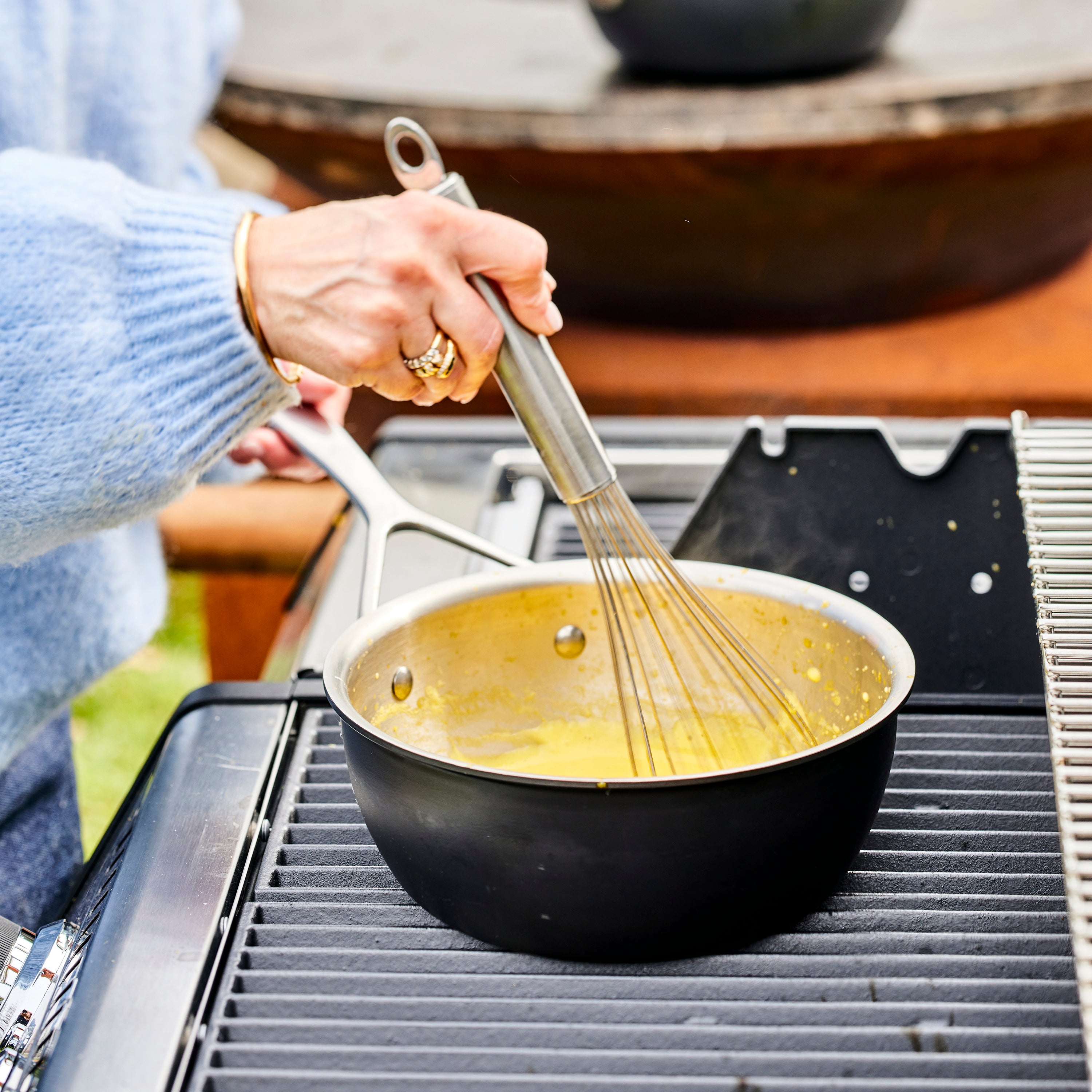 Premium 2-quart induction saucepan with lid showcasing its stainless steel design.