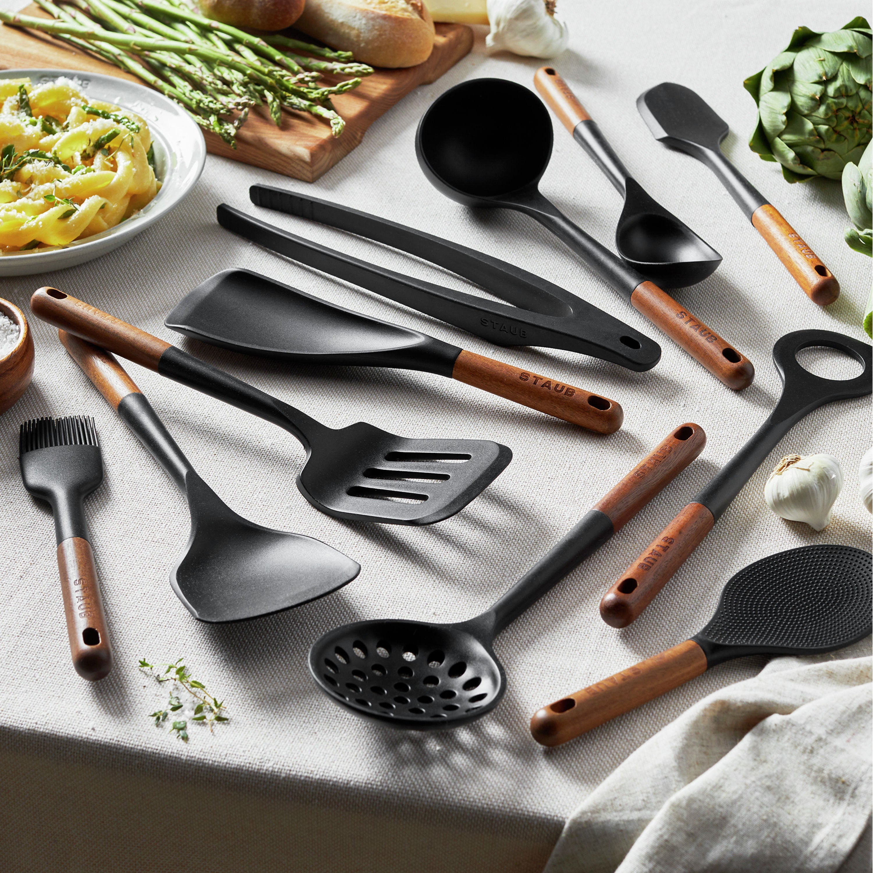 Close-up of durable silicone cooking tools in use, showcasing the unique design and functionality.