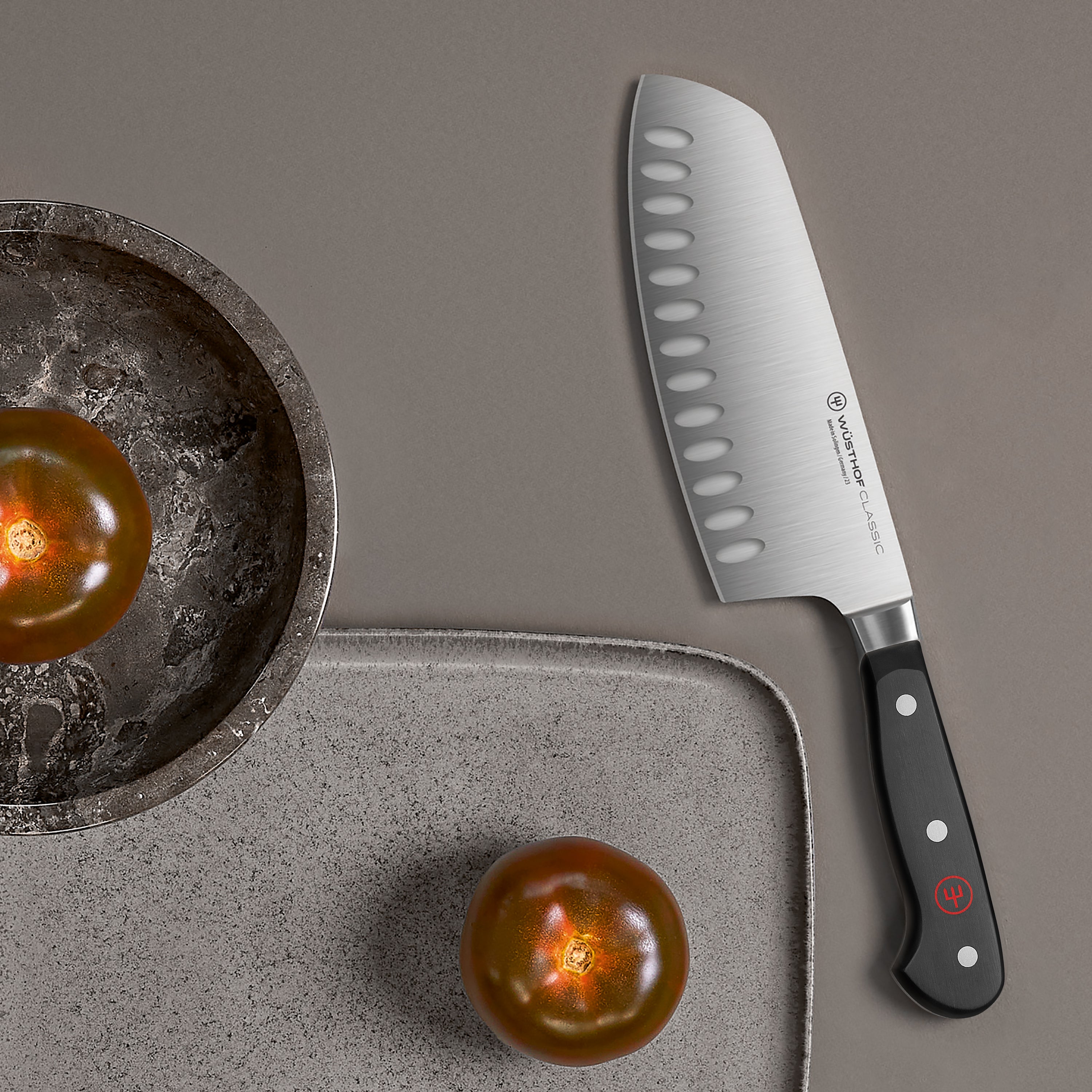 Wusthof Classic 7-inch hollow edge chef knife with sharp blade and ergonomic handle for precise slicing