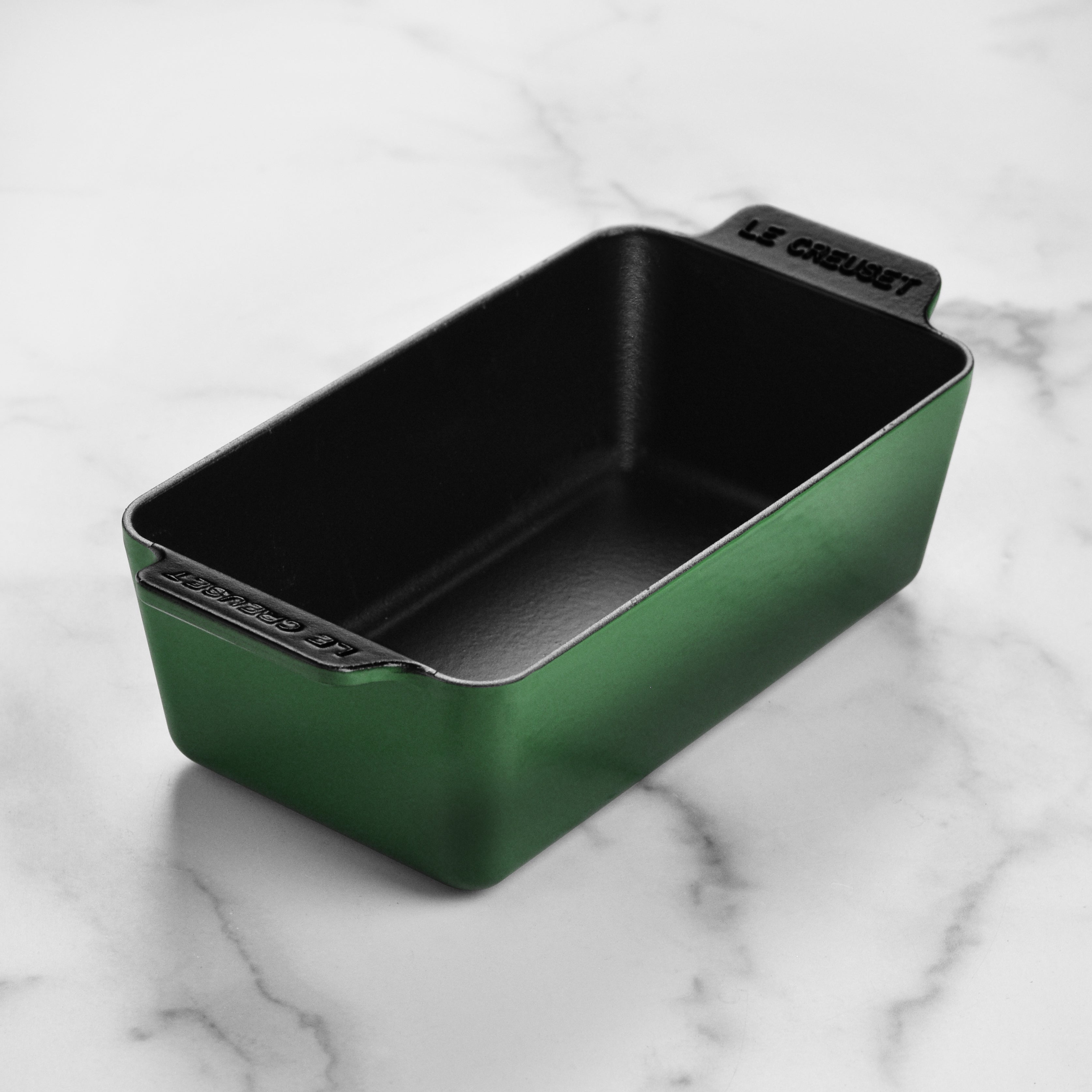 Le Creuset Signature cast iron loaf pan with artichaut design, close-up shot highlighting enamel finish