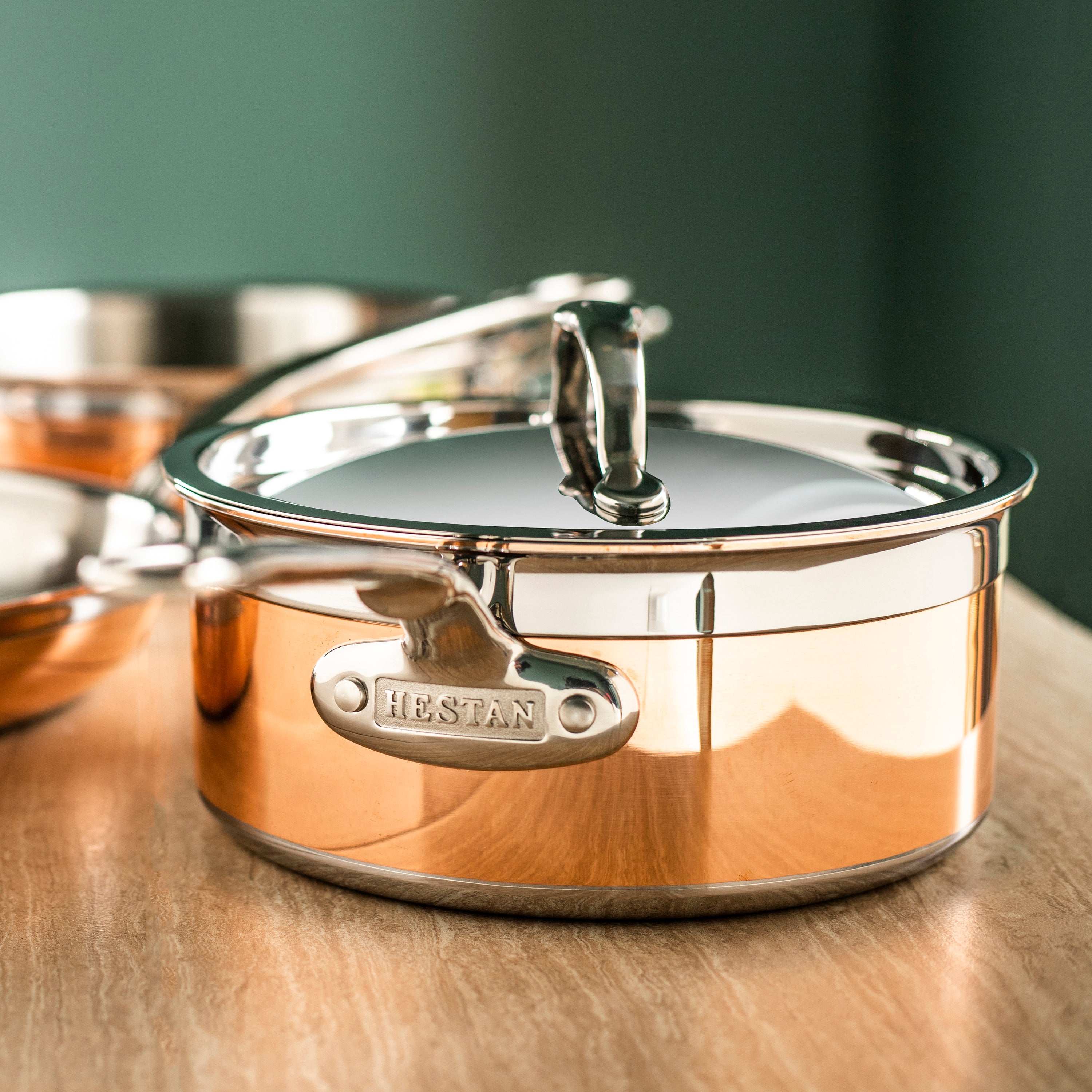 Hestan stainless steel lid on a skillet, demonstrating its snug fit and heat retention capabilities.