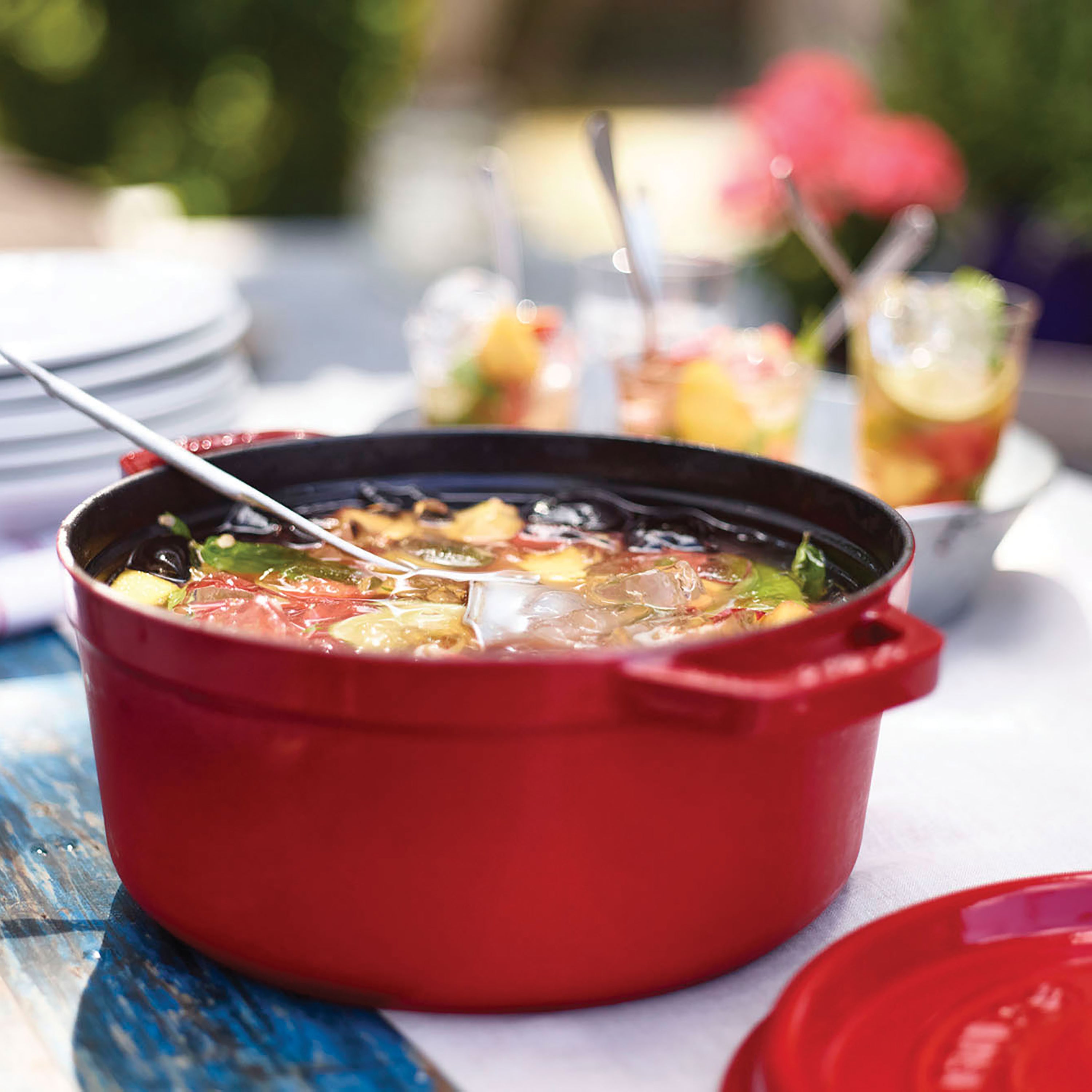 Le Gourmet cast iron Dutch oven with rooster knob and red enamel finish, top view