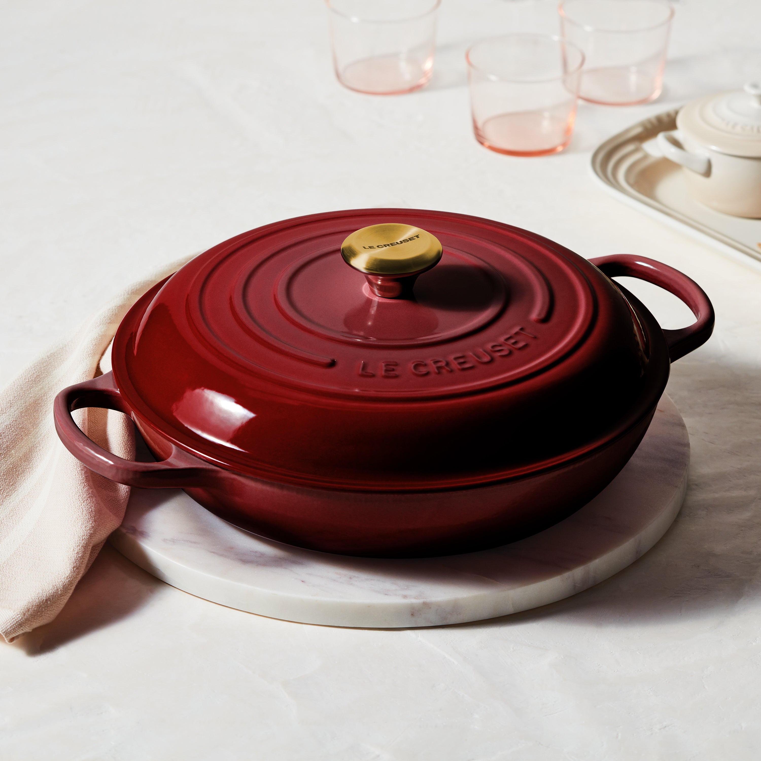 Close-up of the enamel coating and ergonomic handles on the Le Creuset braiser