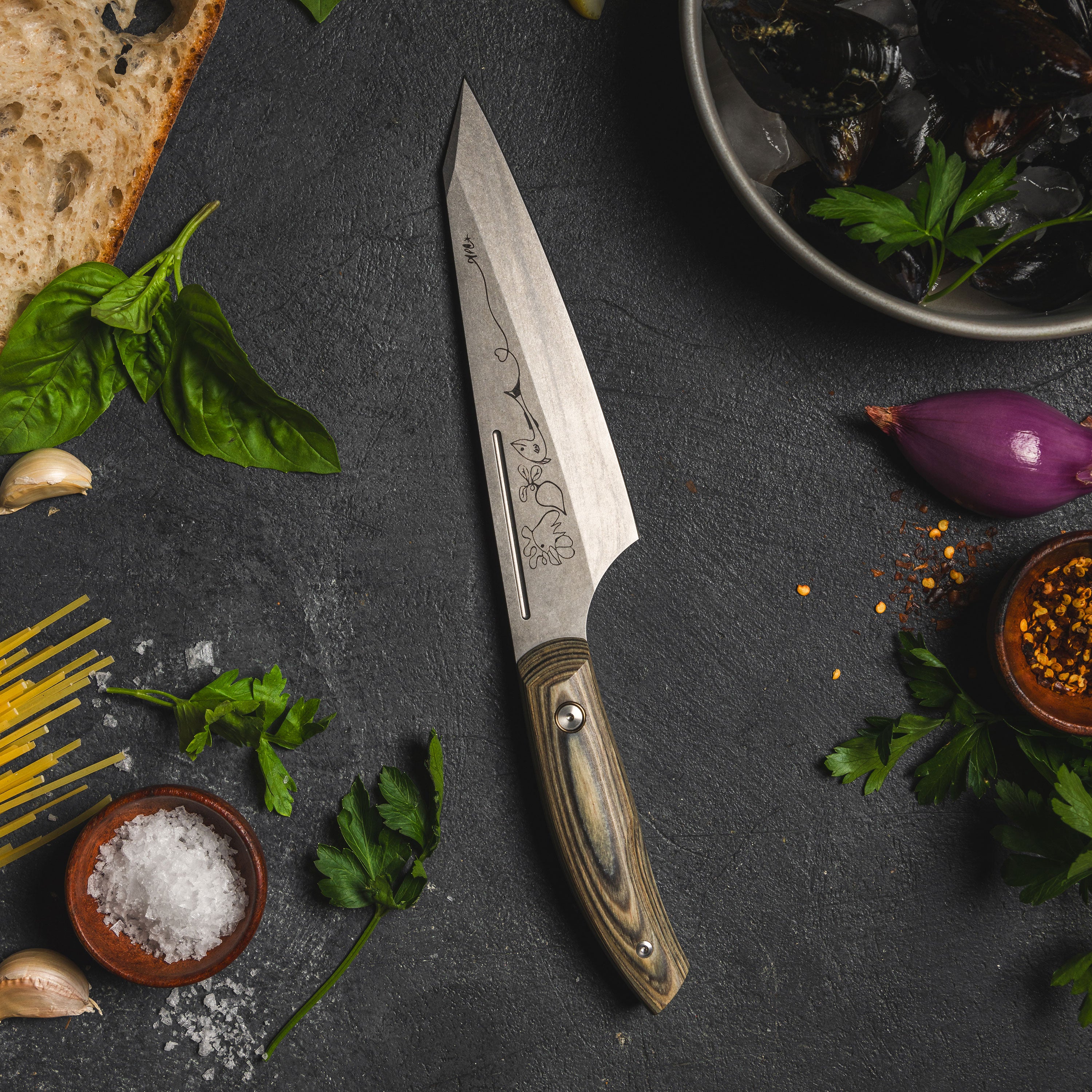 Close-up view of the Bohler K110 chefs knife showcasing the ceramic stonewash finish