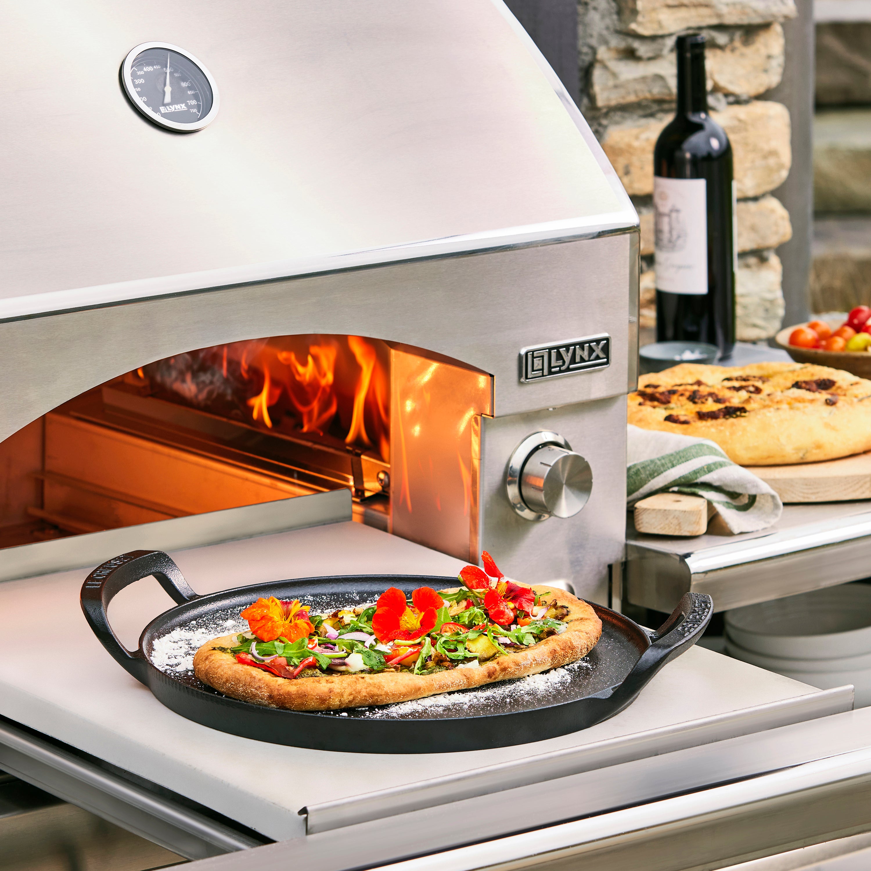 Close-up of Le Creuset cast iron pizza pan showing matte black enamel