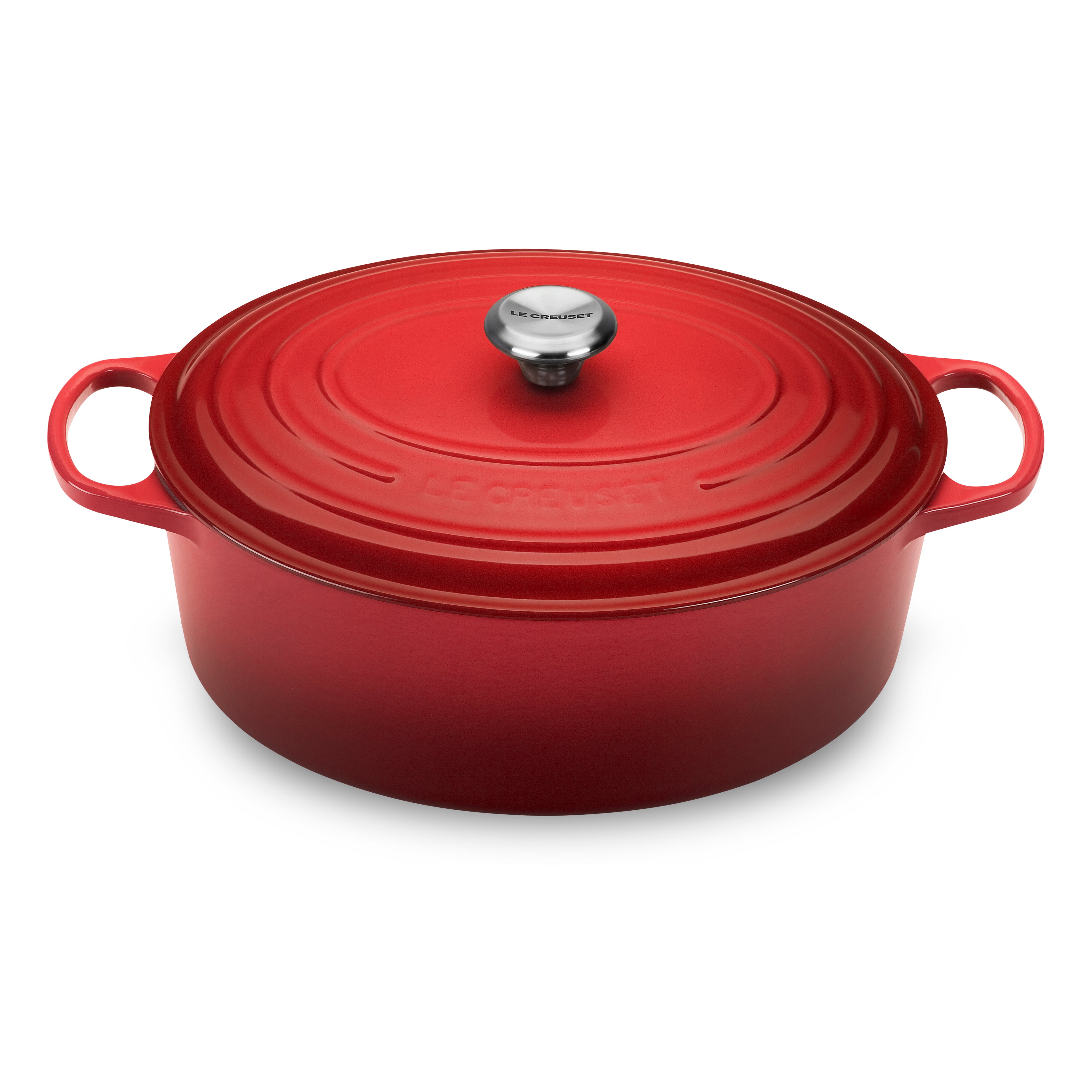 Le Creuset cast iron Dutch oven in Cerise red with lid off, showing interior for baking