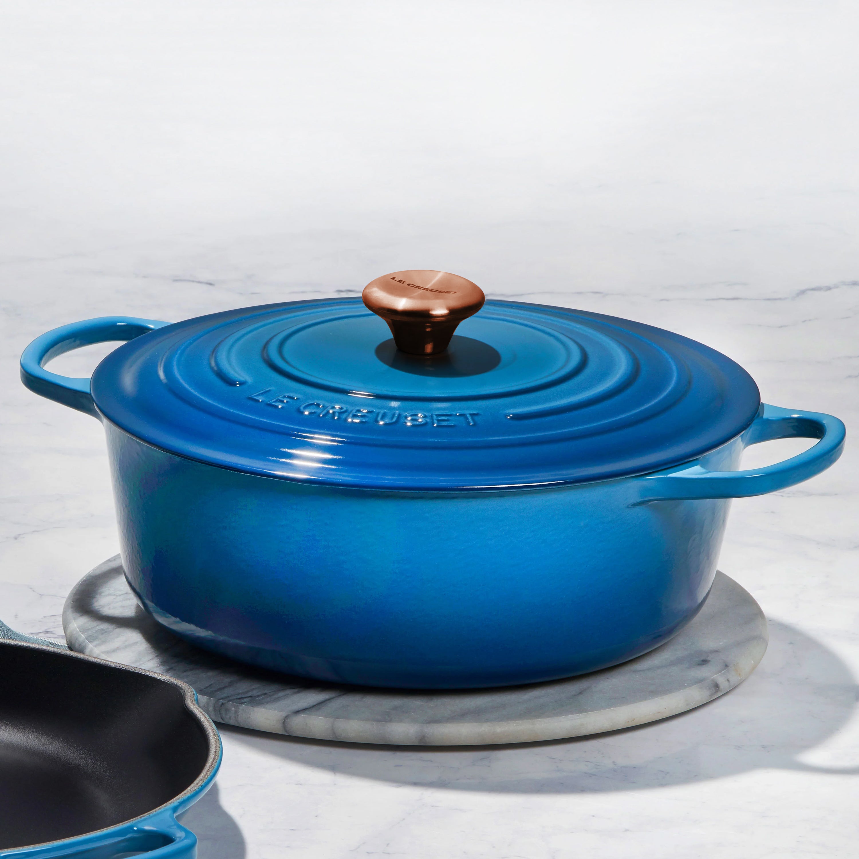 Empty cast iron Dutch oven with handles, ready for baking or roasting