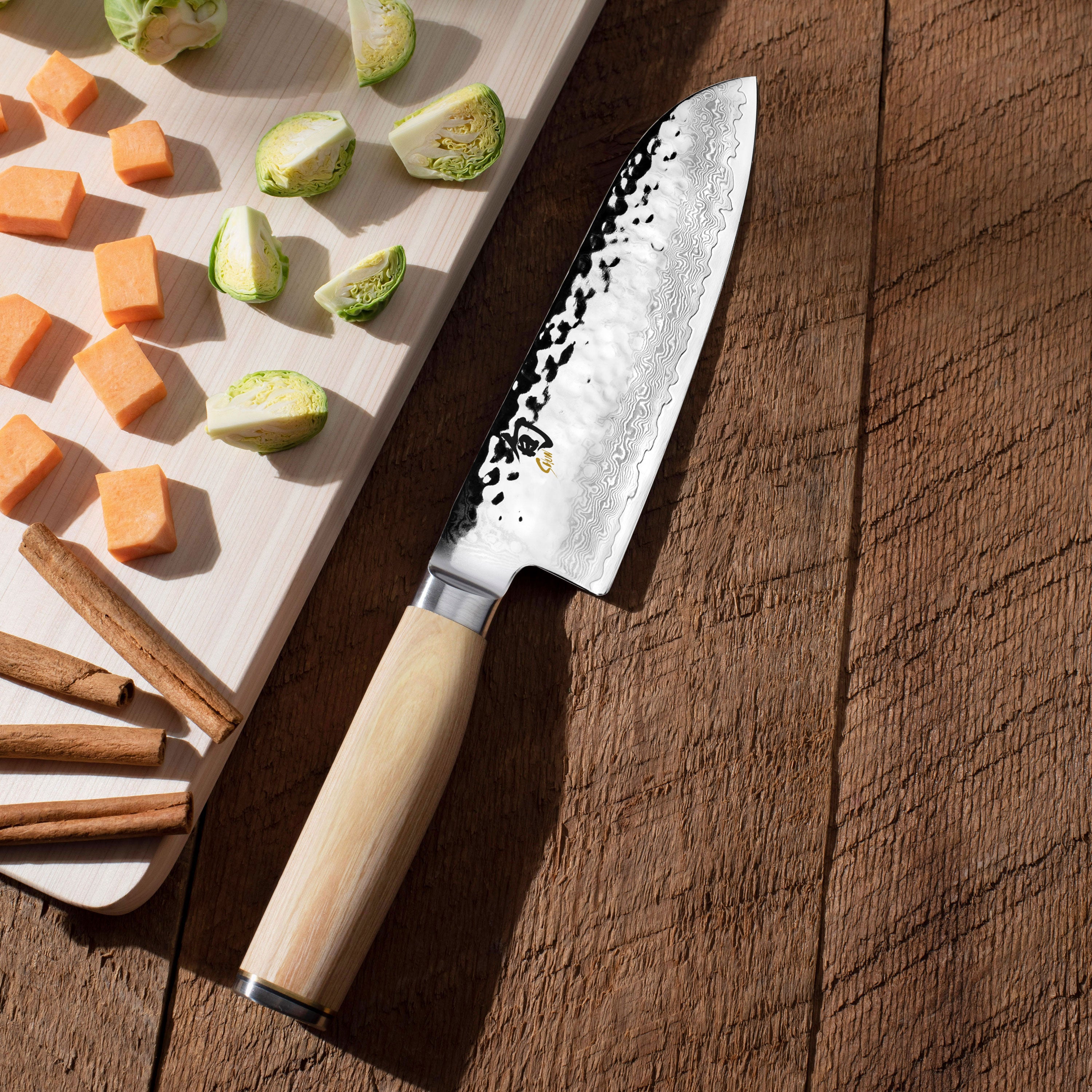 Chef slicing vegetables using the Shun Premier Blonde kitchen knives