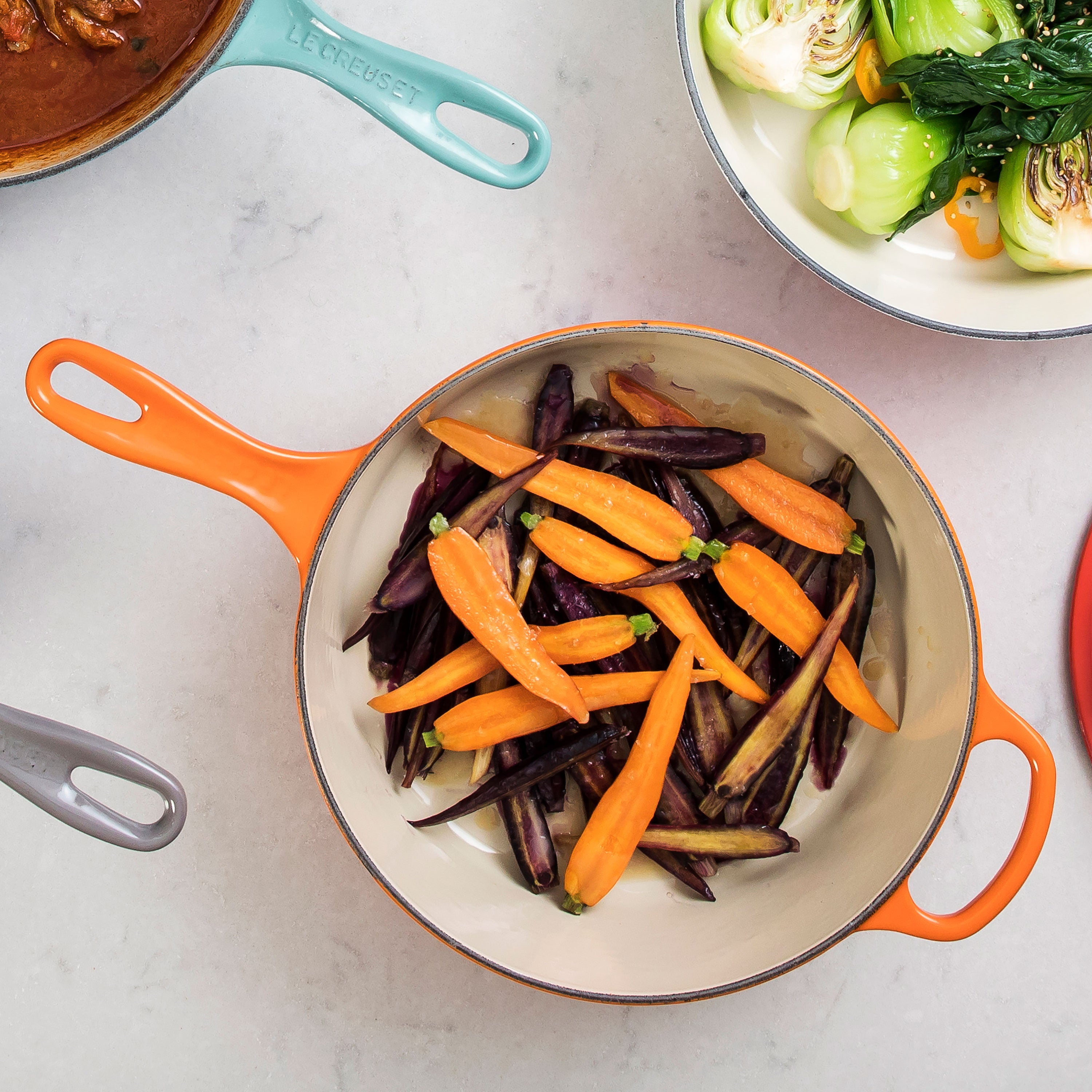 Close-up of the ergonomic knob and wide-loop handle on Le Creuset Dutch oven