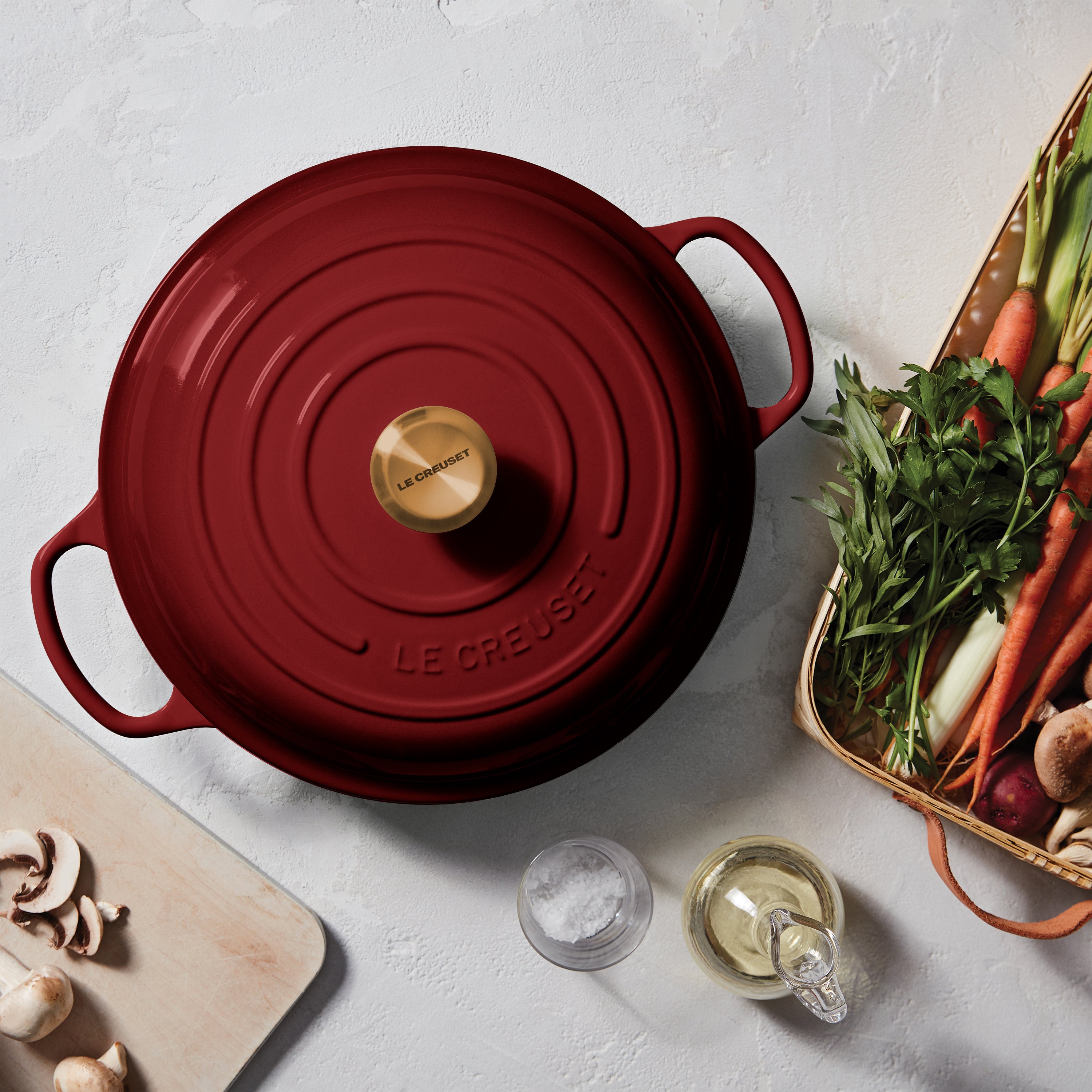 Le Creuset signature cast iron braiser with lid, front view highlighting the gold finish stainless steel knob