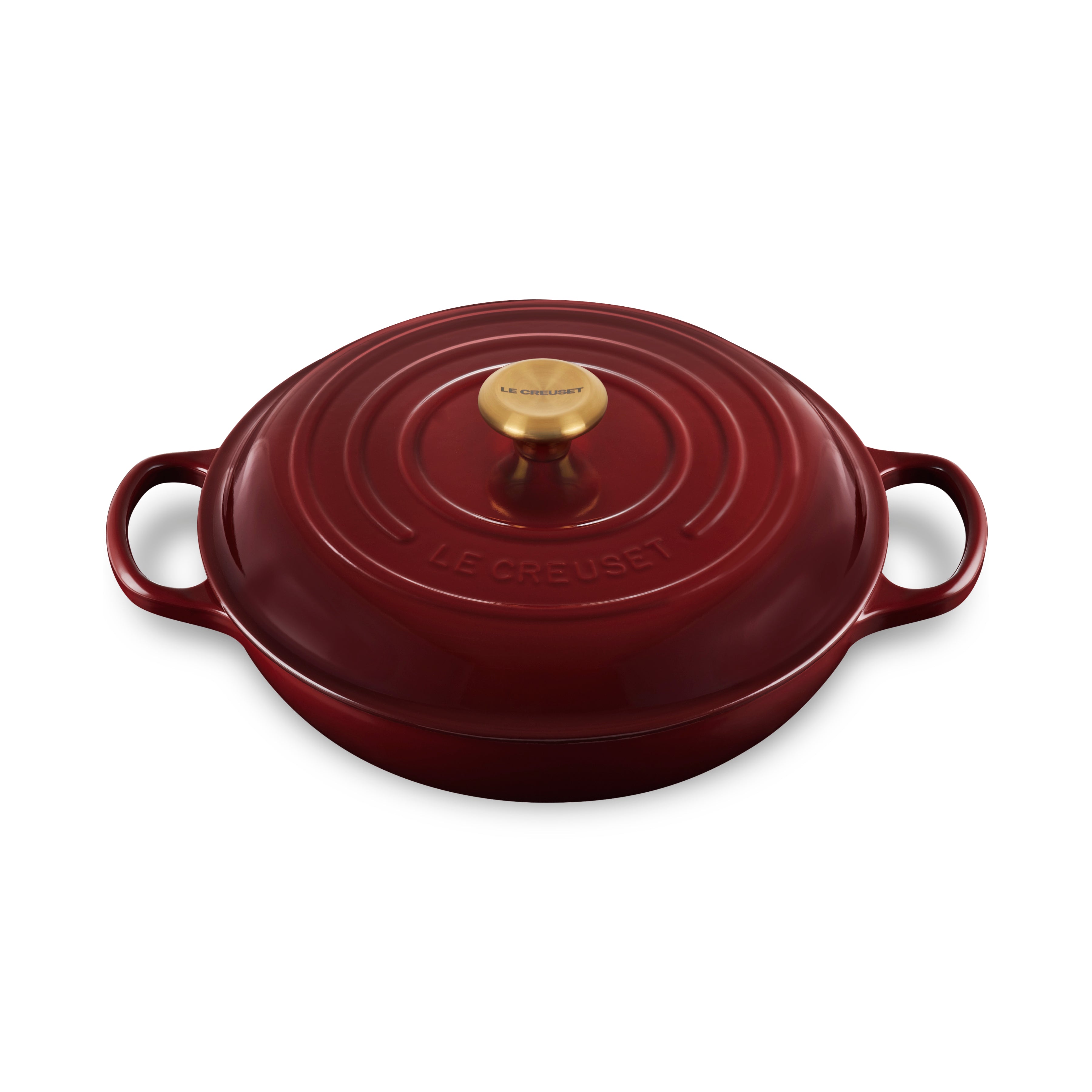 Le Creuset signature cast iron braiser with lid, front view highlighting the gold finish stainless steel knob