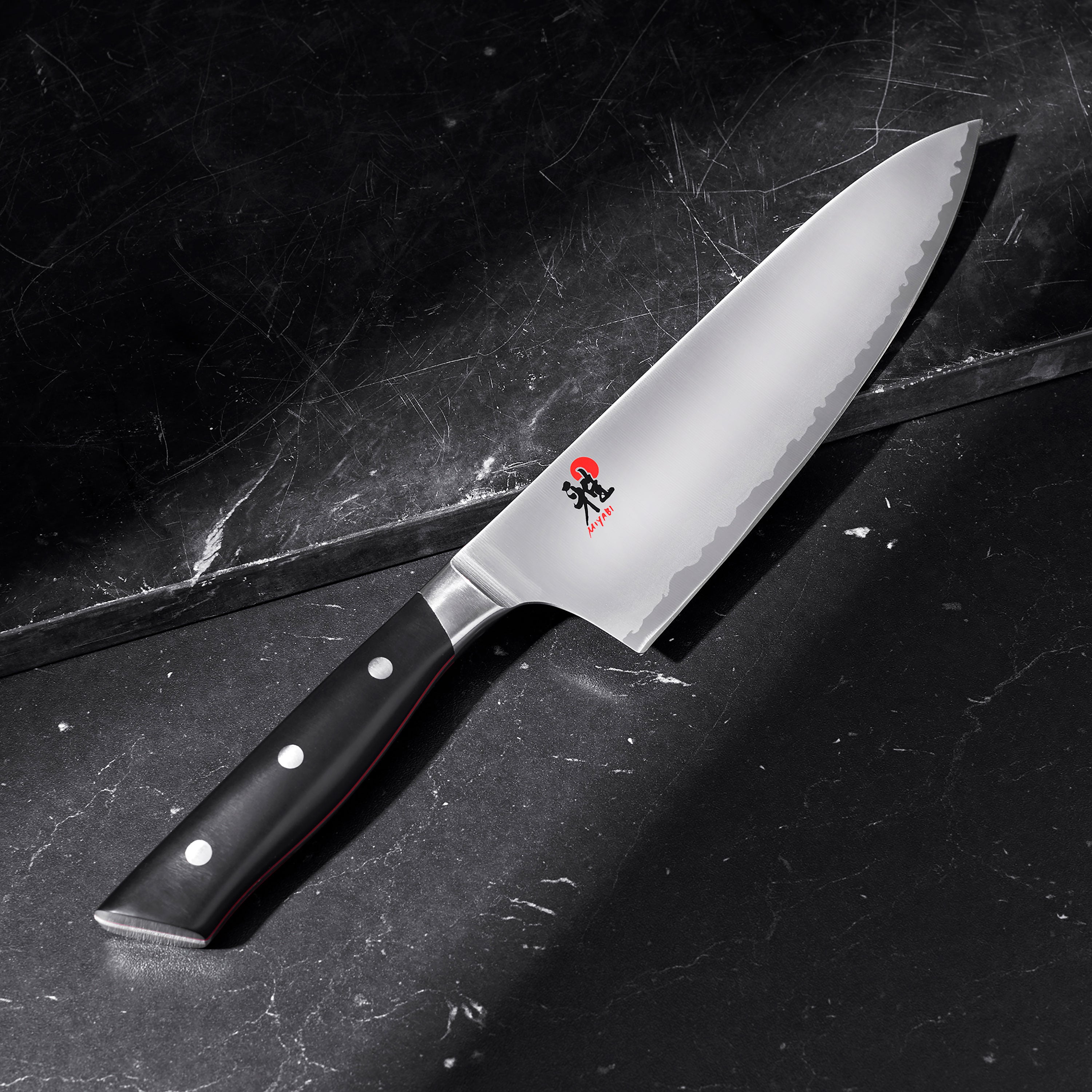 Close-up of the ergonomic handle of the Miyabi Evolution chef knife.
