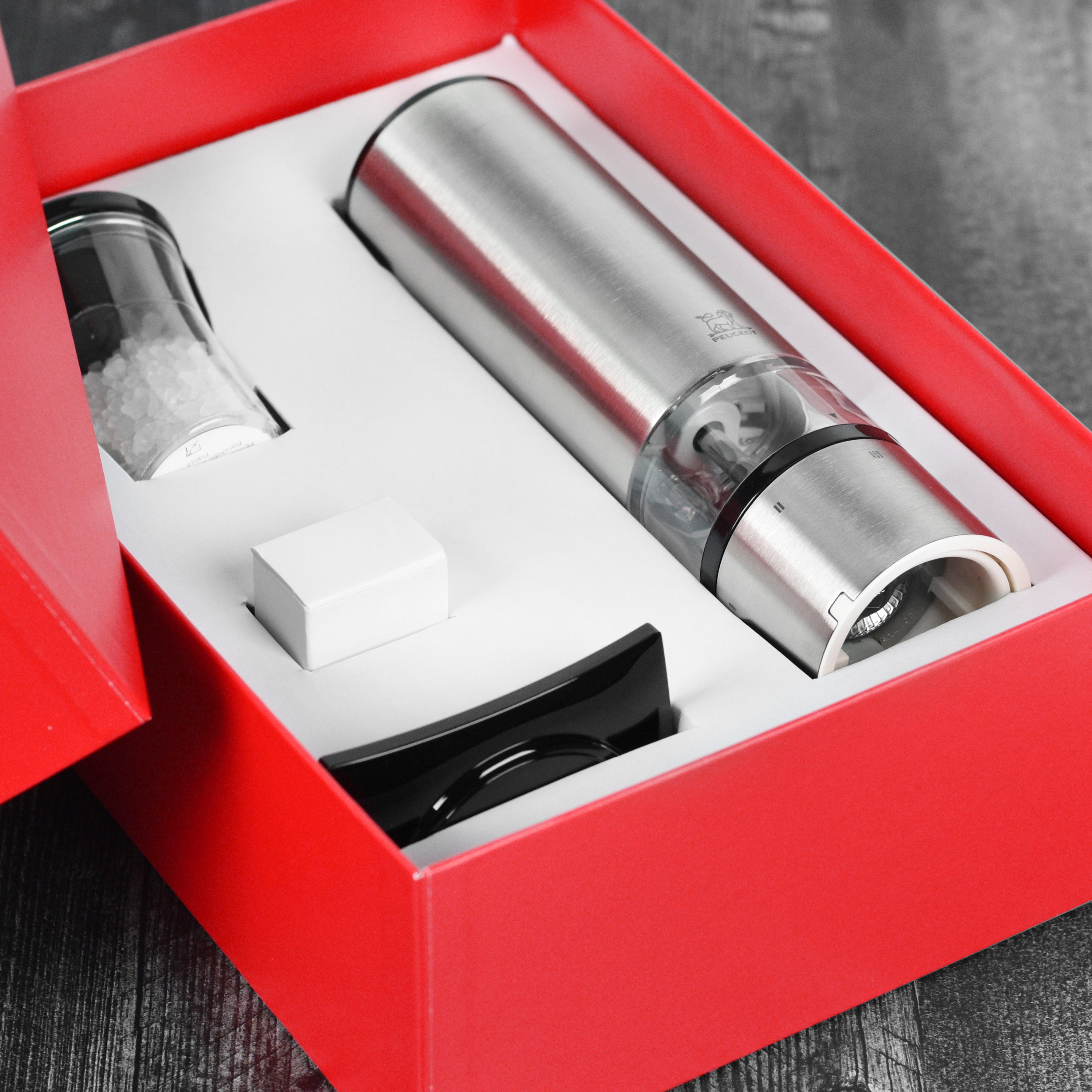 Stylish electric salt mill set against a gourmet kitchen backdrop
