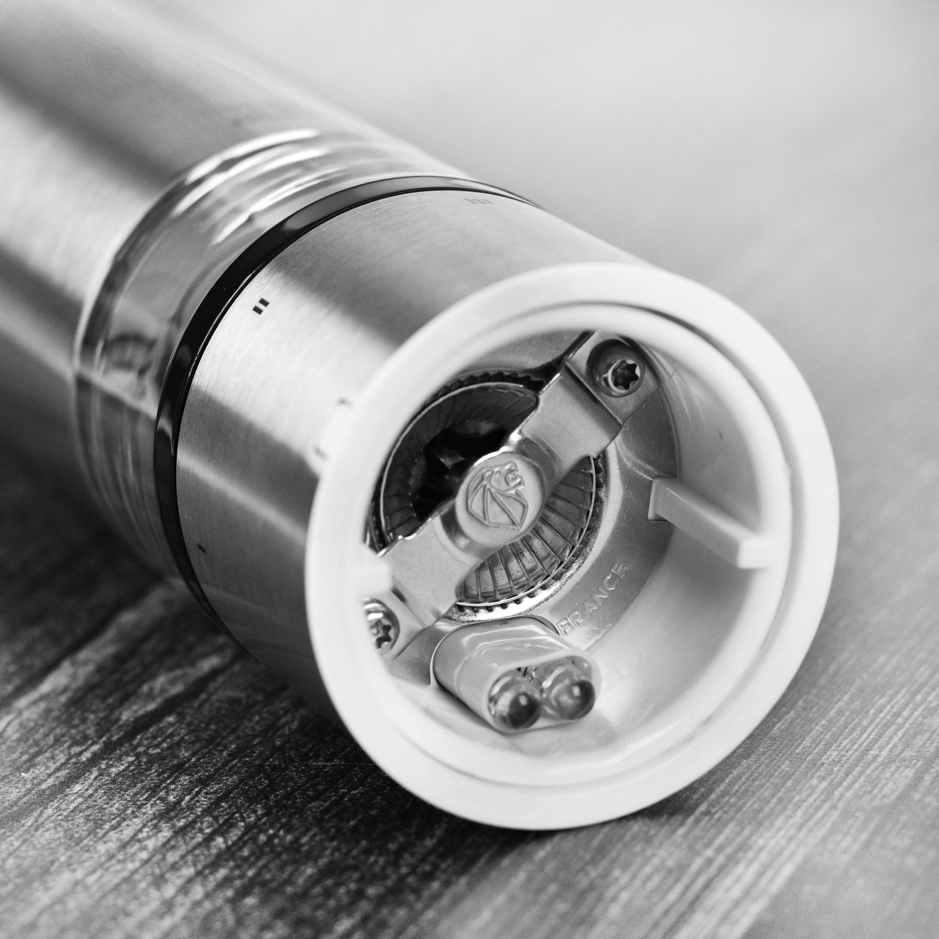 Close-up of the premium stainless steel salt mill showing the LED light
