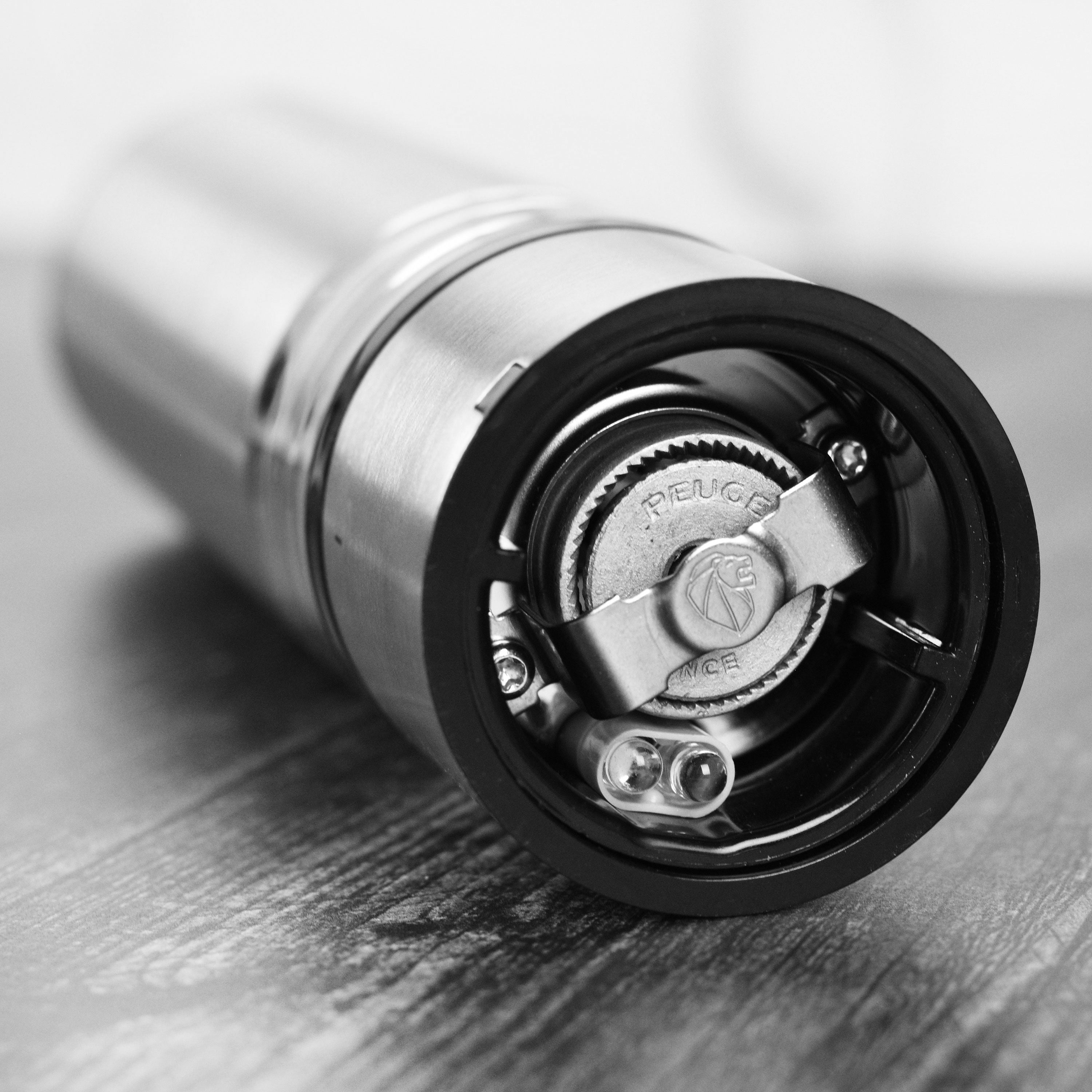 Close-up of the stainless steel housing of the Peugeot Elis Sense pepper grinder.