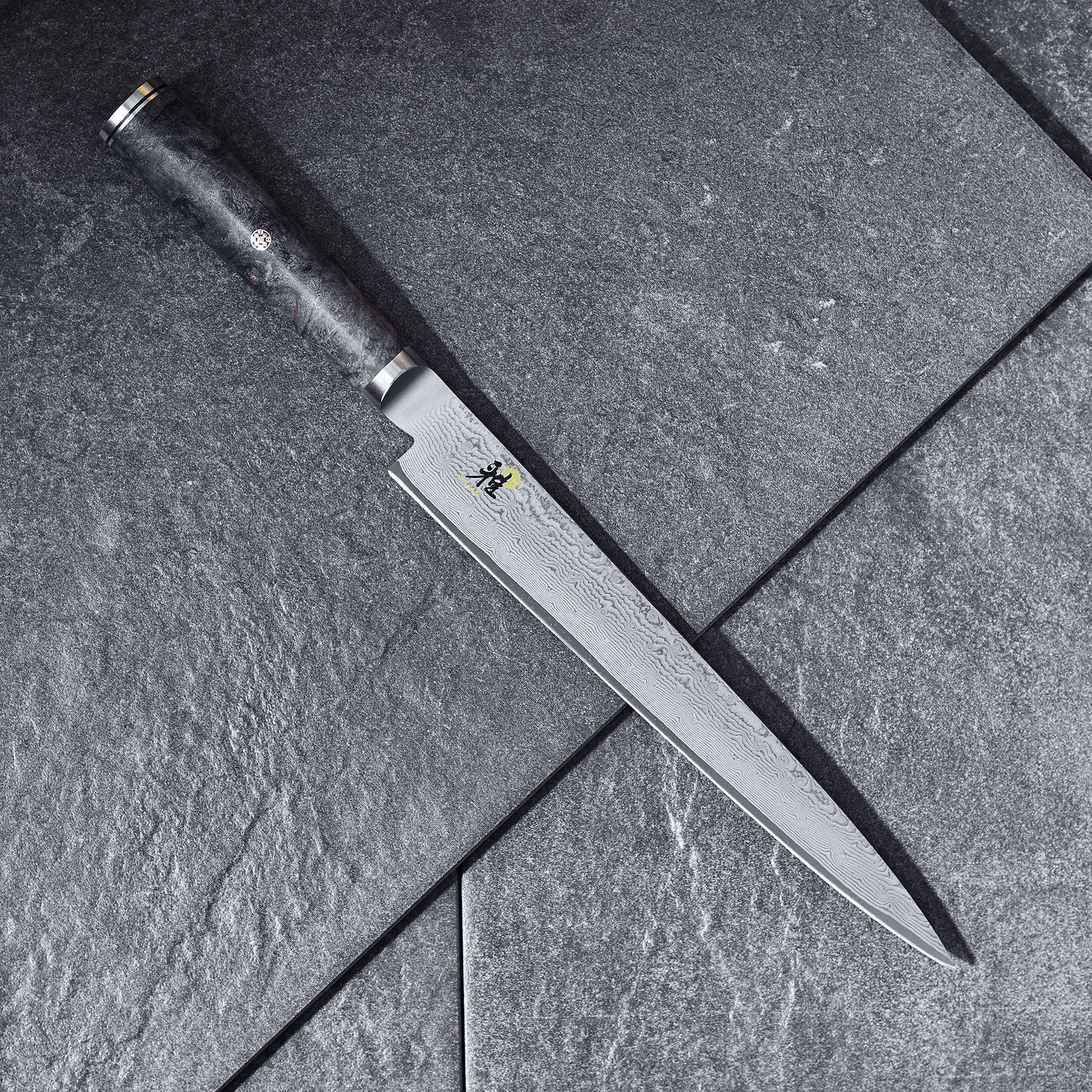 Close-up of the Miyabi Black Slicing Knife highlighting its sharp edge and craftsmanship