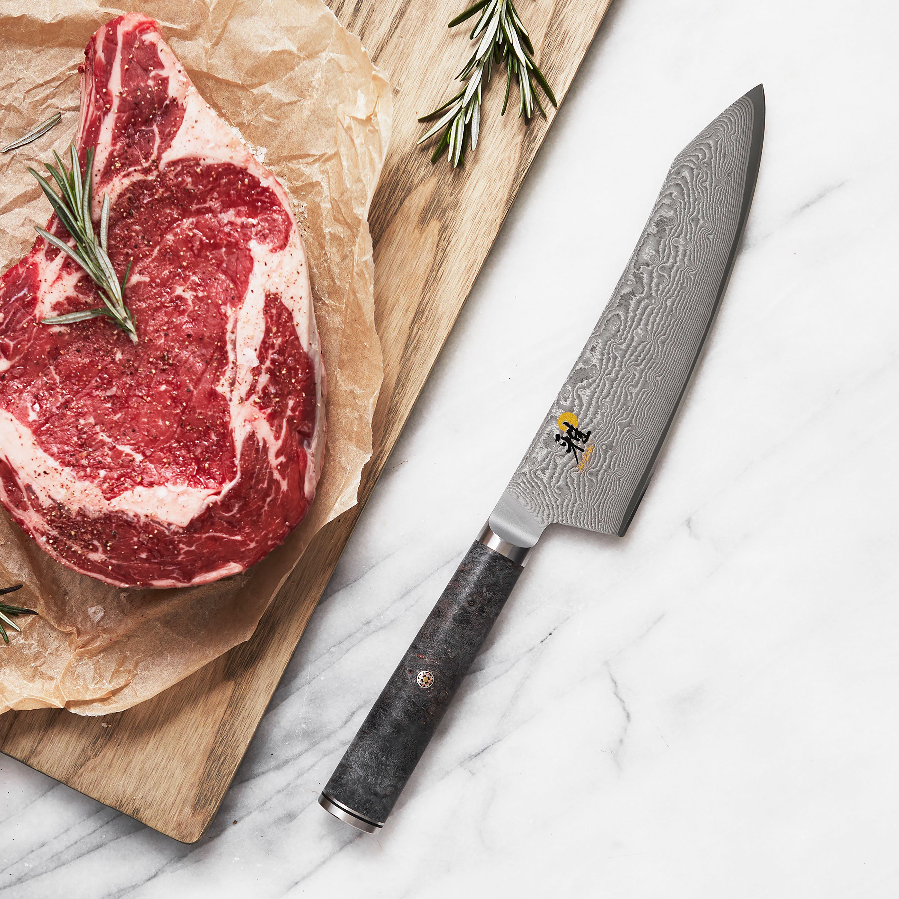 Miyabi Black 7-inch santoku knife with Damascus pattern and black handle for detailed kitchen prep