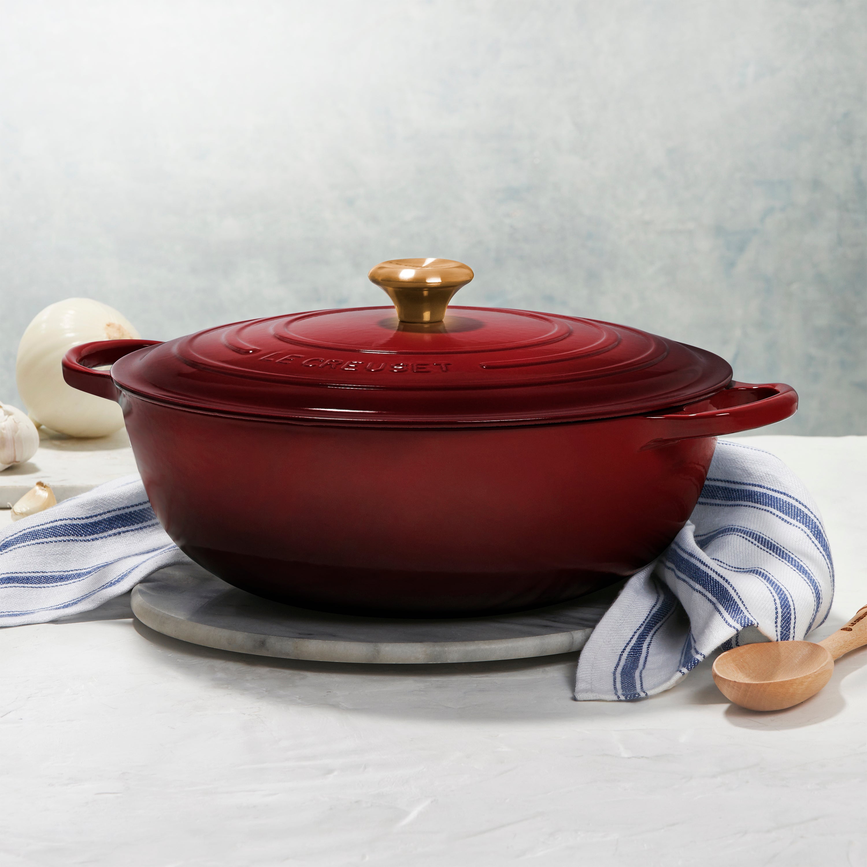 Le Creuset Rhone Chefs Dutch Oven with a vibrant finish, highlighting its ergonomic design and sturdy handles.