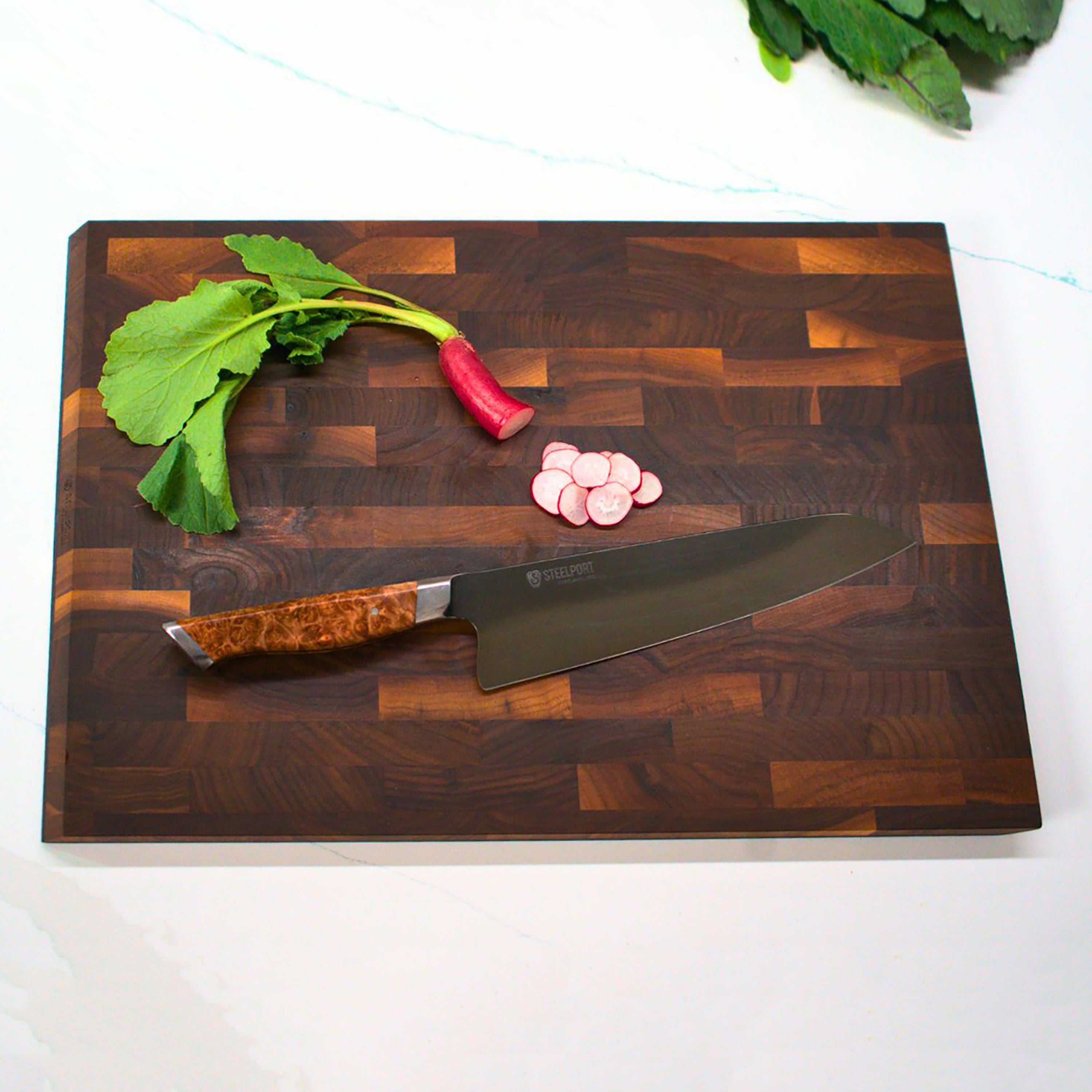 Side view of Steelport end-grain walnut cutting board highlighting beveled edges and slim profile