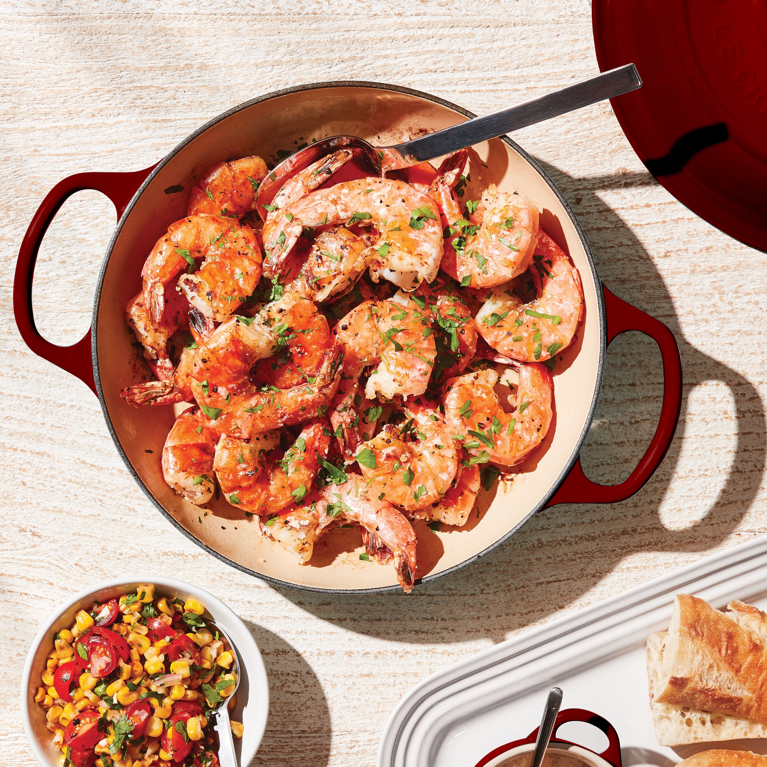 Le Creuset signature cast iron braiser with lid, front view highlighting the gold finish stainless steel knob