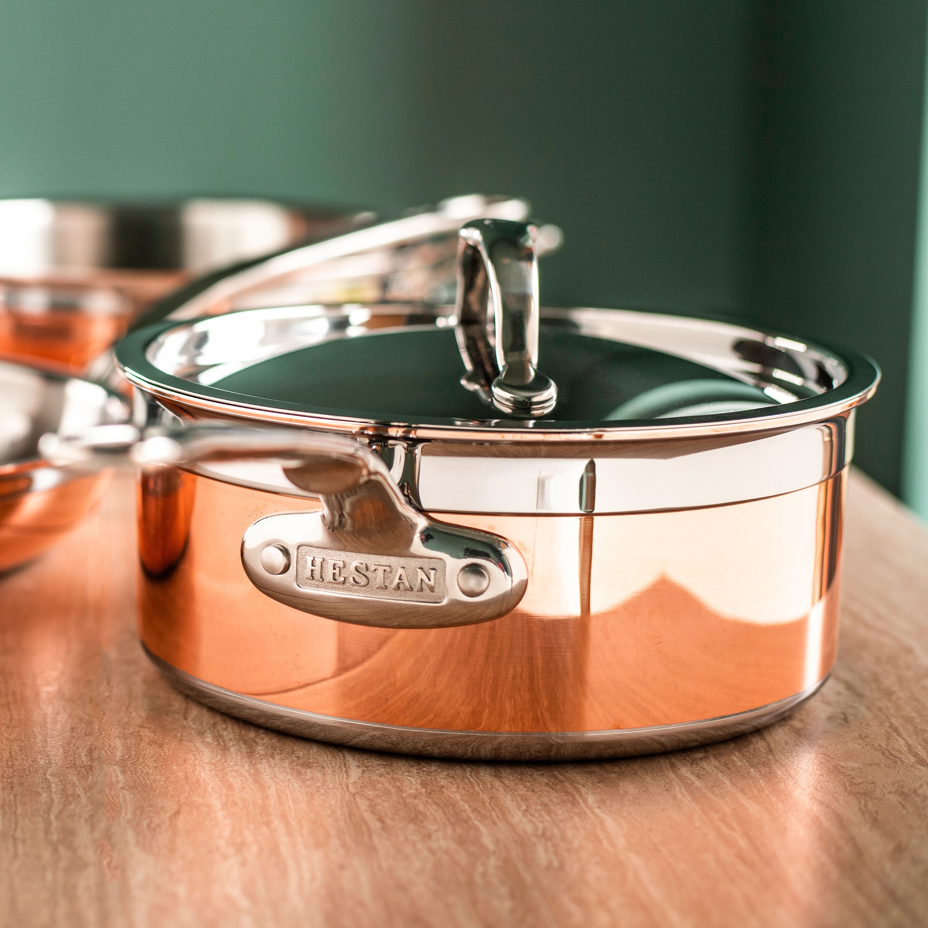 Hestan CopperBond cookware set showcasing the copper and stainless steel finish from an overhead angle.