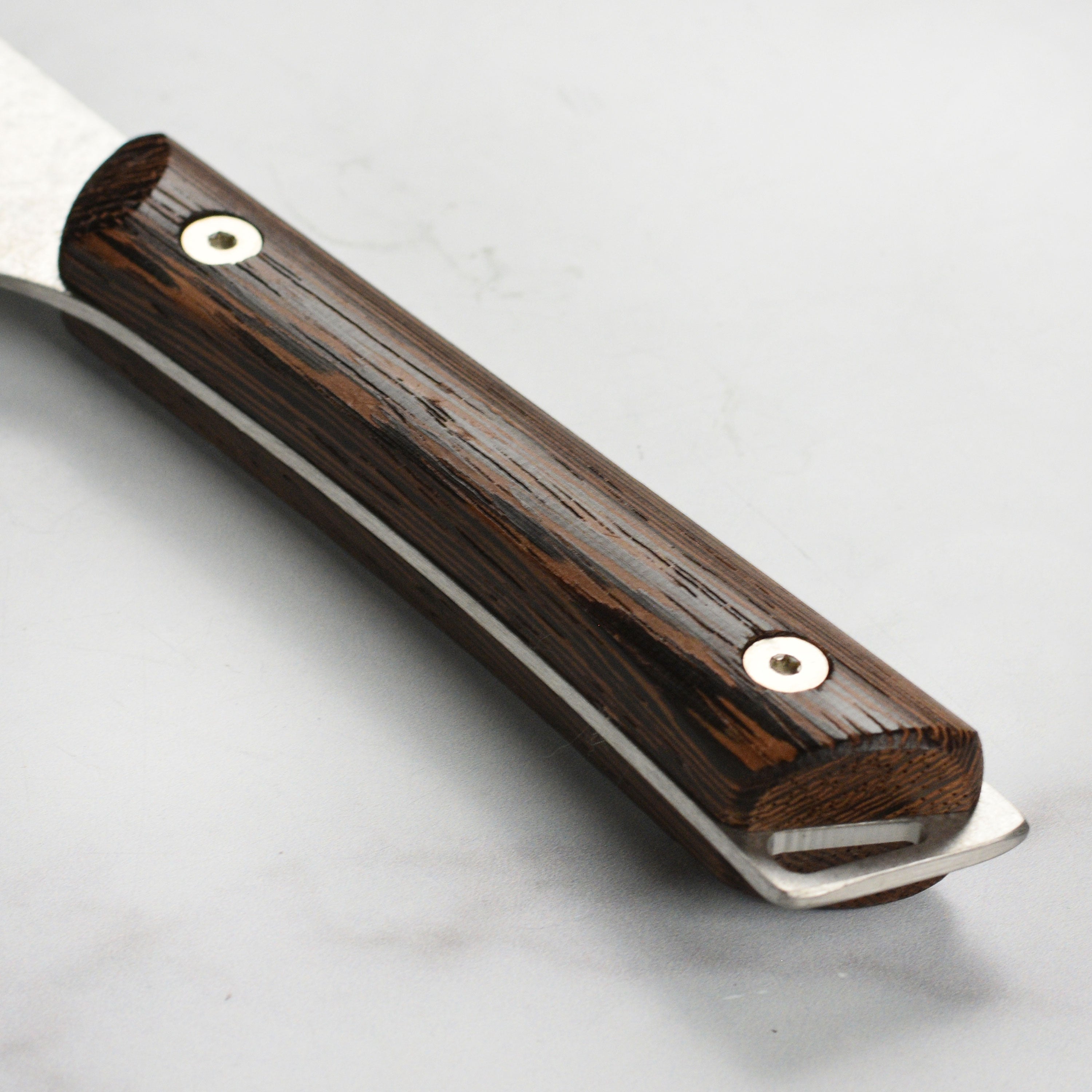 The complete Shun Kanso Santoku knife set displayed on a wooden cutting board, emphasizing its elegant design.