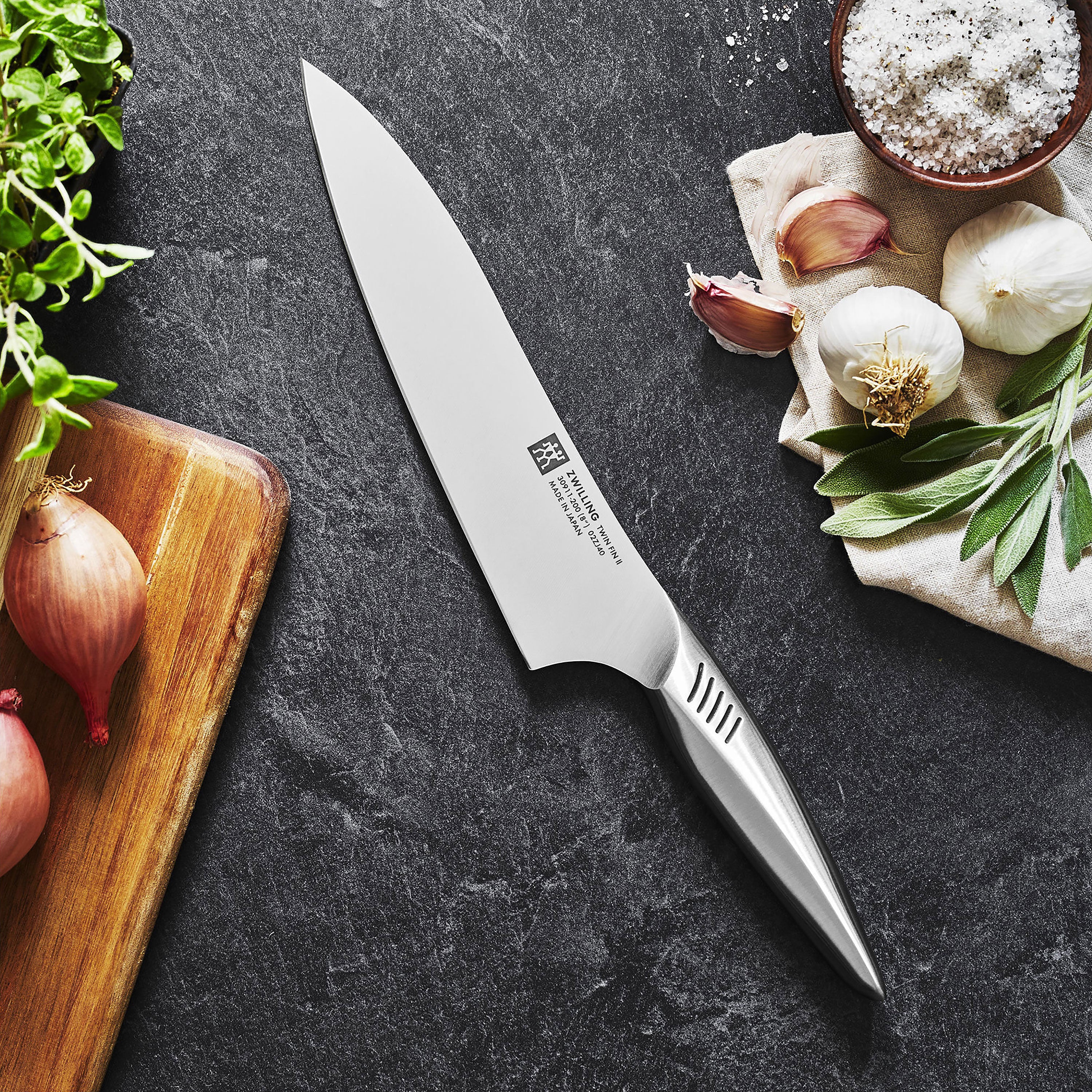 Close-up of the forged blade and hollow handle from the Zwilling Twin Fin II bamboo knife set