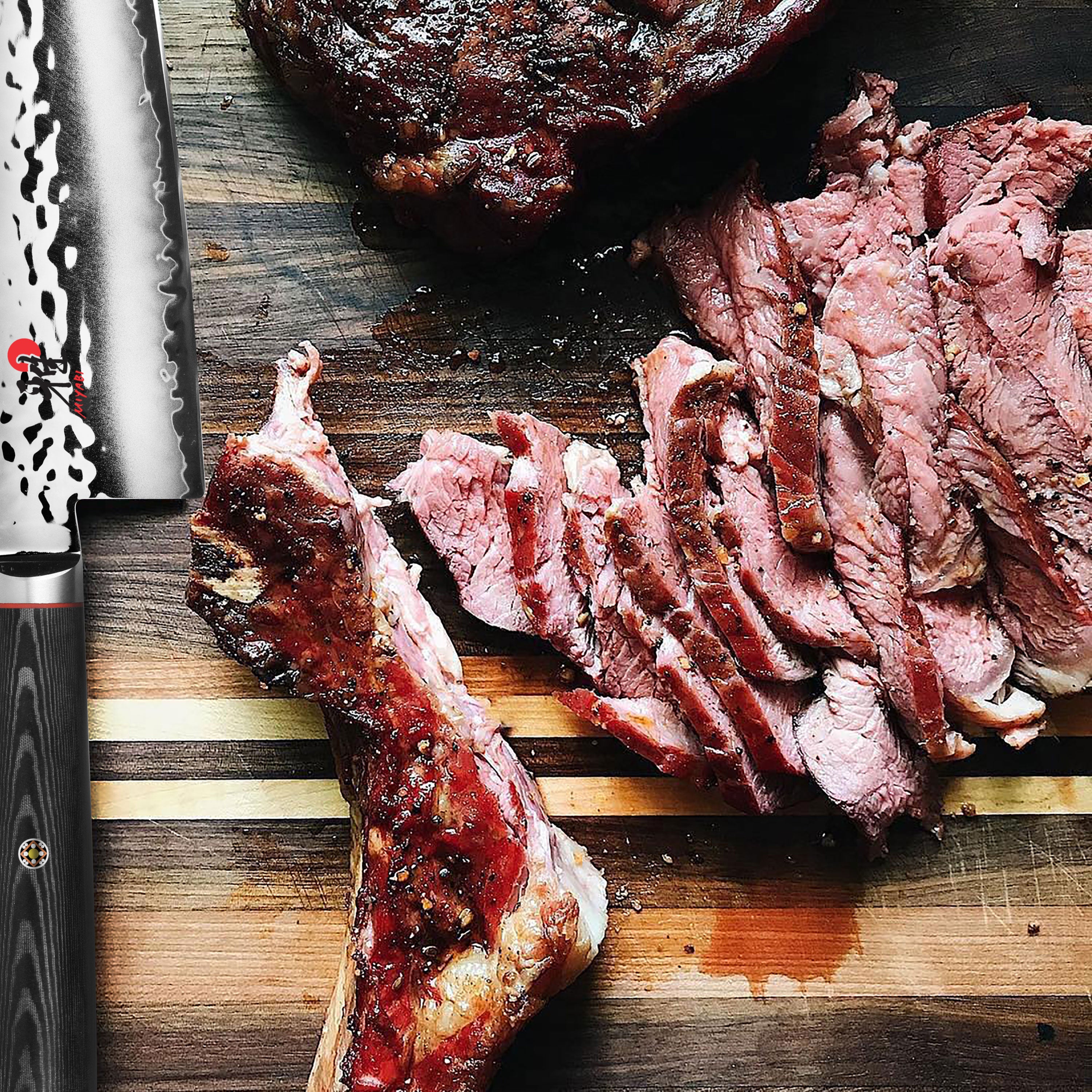 The complete Miyabi Mizu SG2 knife set arranged on a wooden cutting board, highlighting its premium quality.