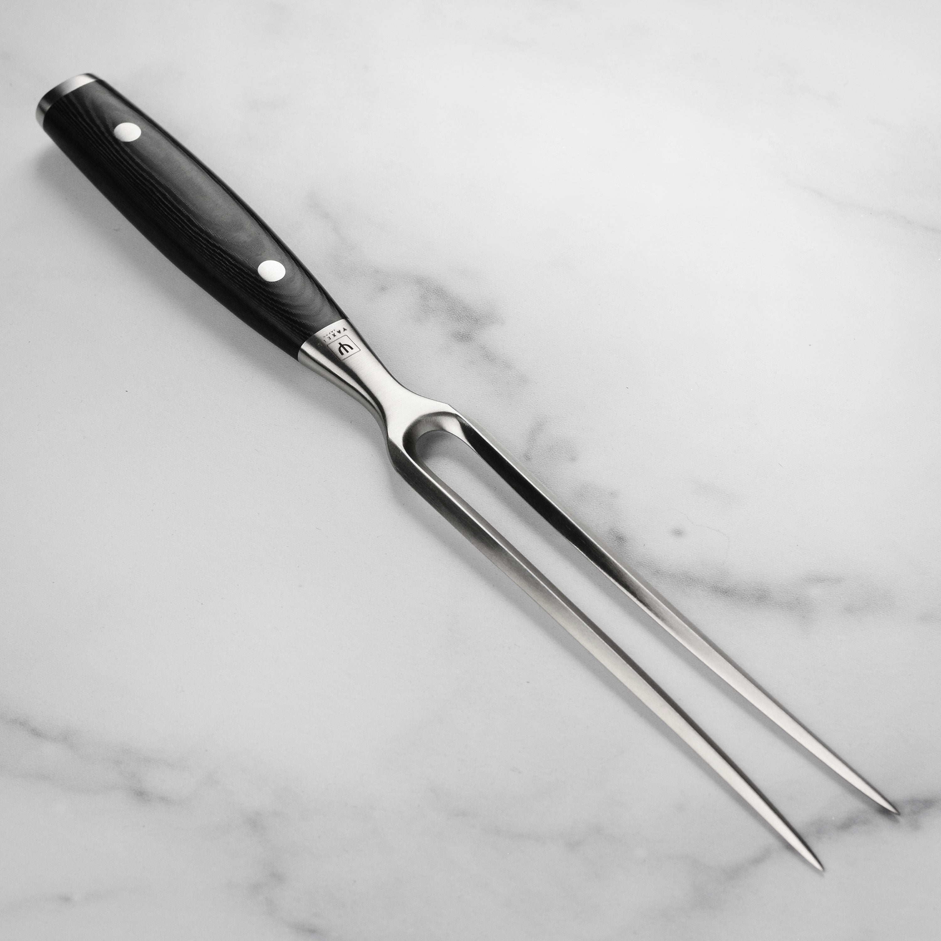 Yaxell Ran Plus carving fork showcasing stainless steel tines and a micarta handle from different angles.
