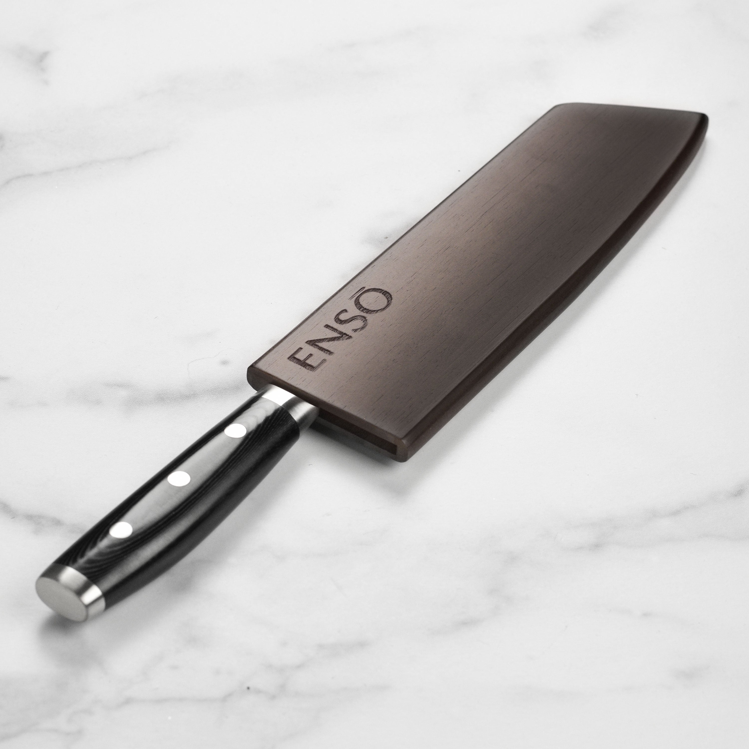 Enso HD 8-inch kiritsuke knife with magnetic sheath in a professional kitchen setting