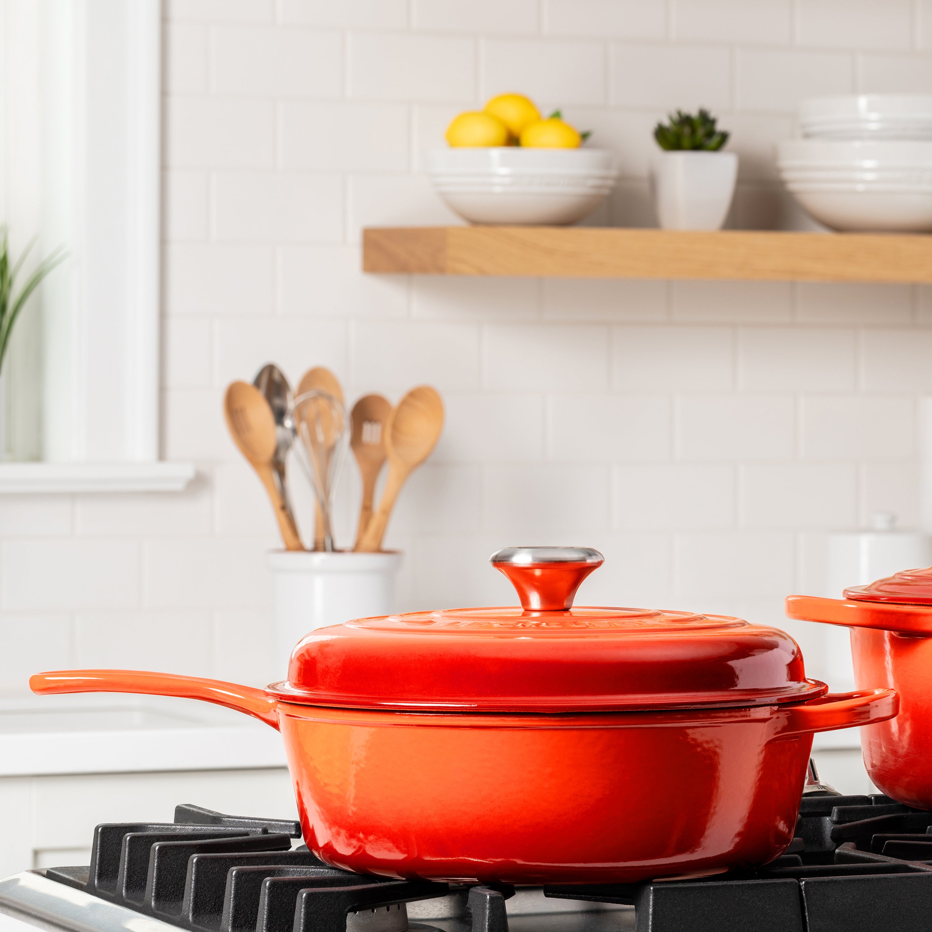 Close-up of the ergonomic knob and wide-loop handle on Le Creuset Dutch oven
