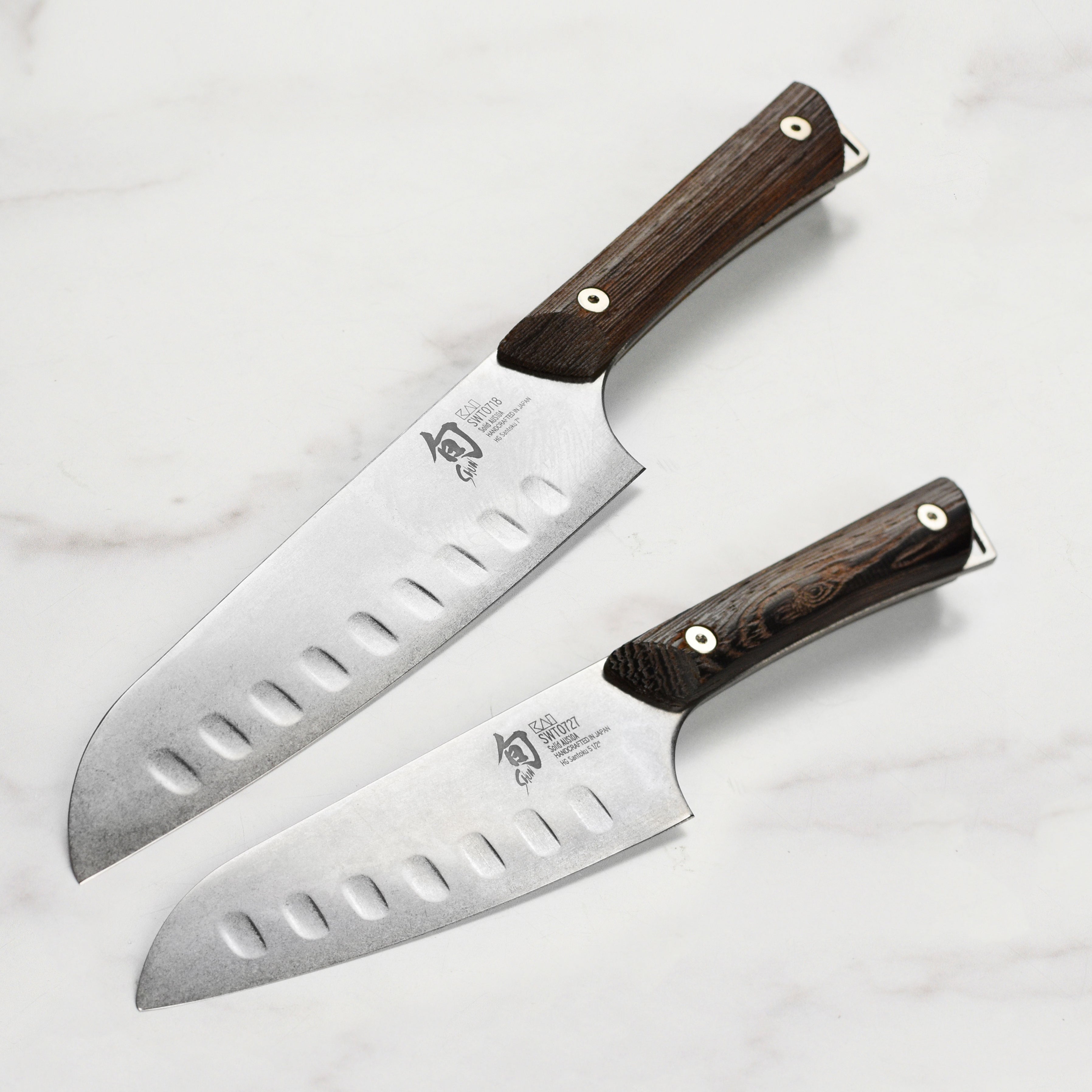 Side view of the Shun Kanso knife set, showcasing the contoured tagayasan wood handle for better grip.