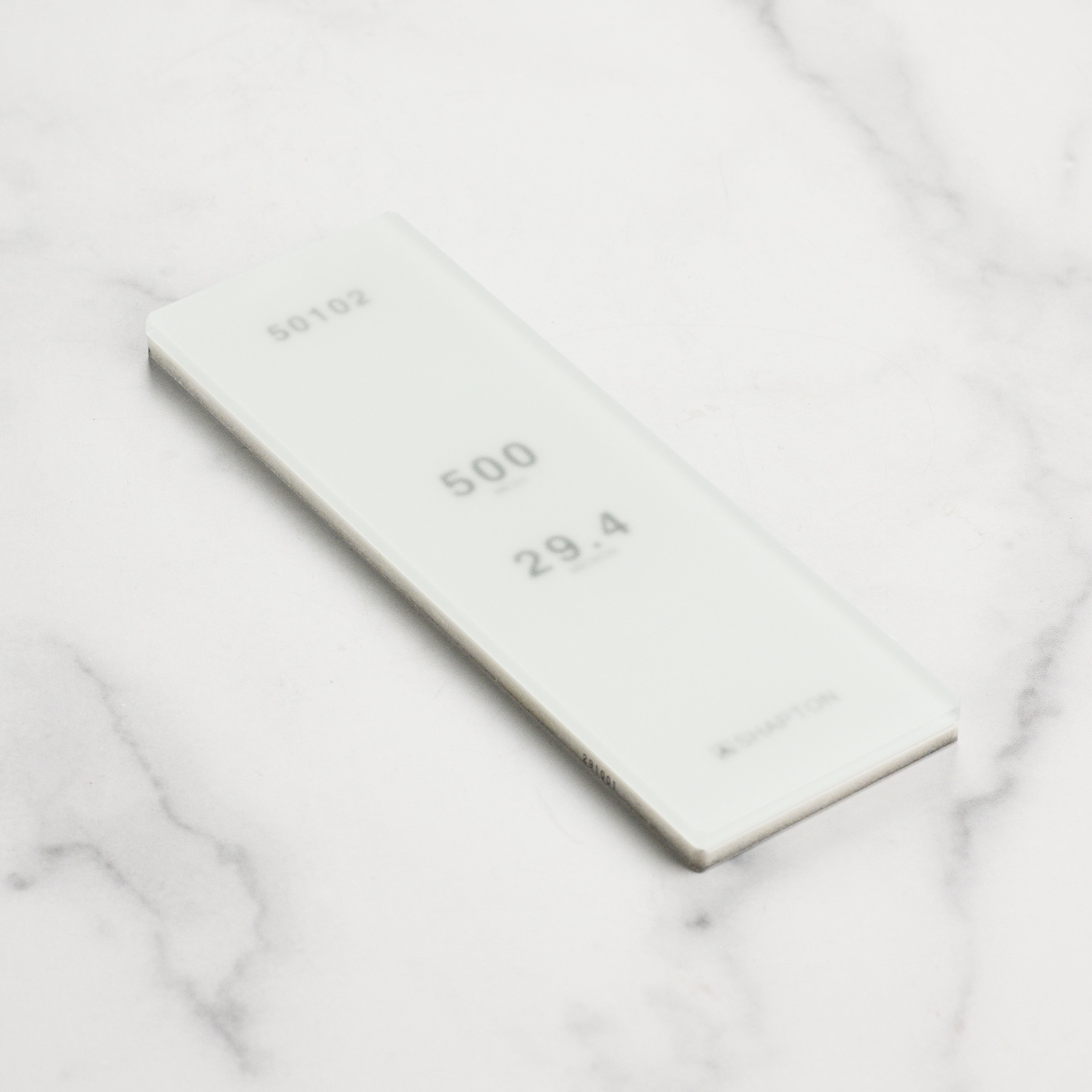 Top view of the ceramic water stone showing its smooth, polished surface for quick bevel setting