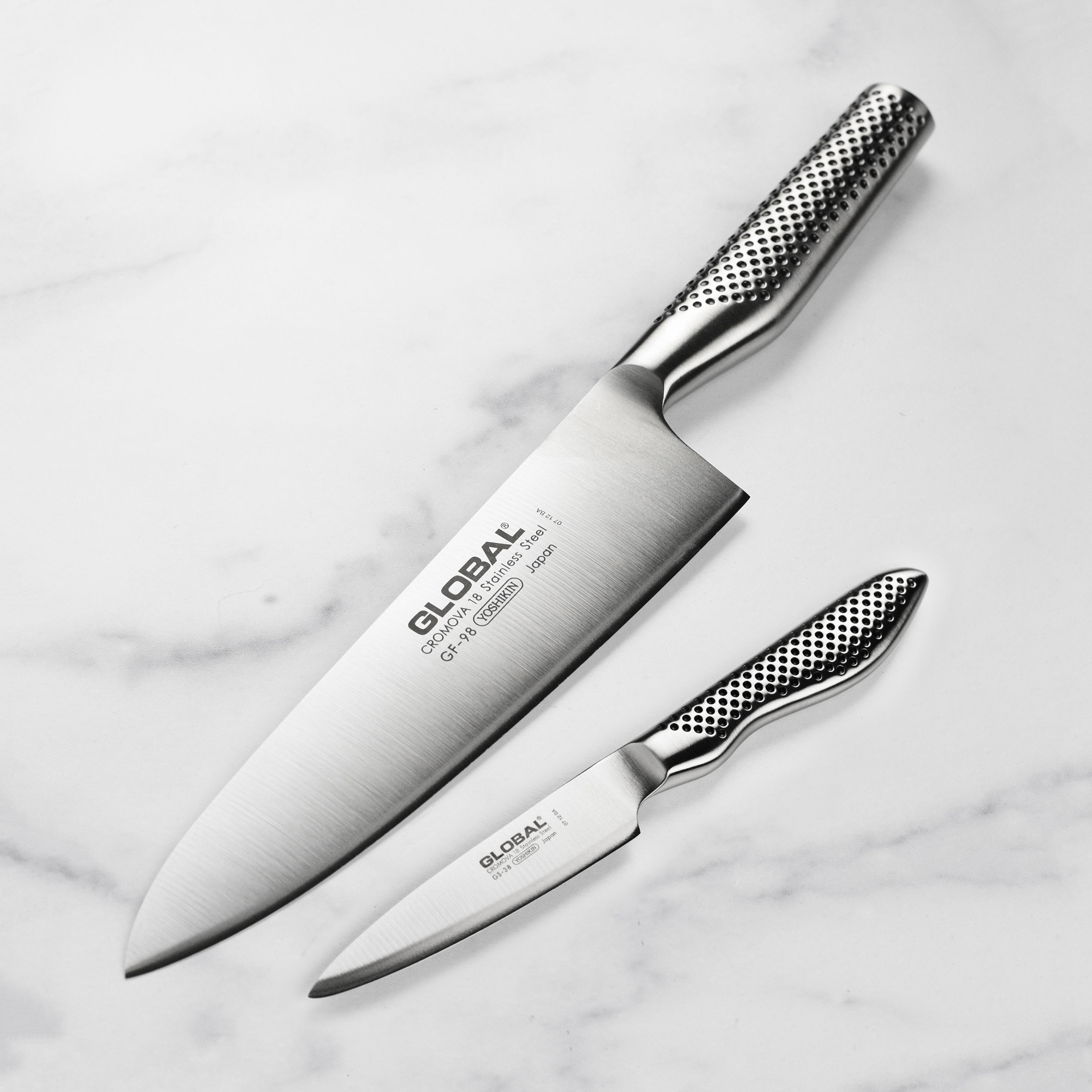 Close-up of a high carbon stainless steel chef knife with ergonomic handle for professional cooking