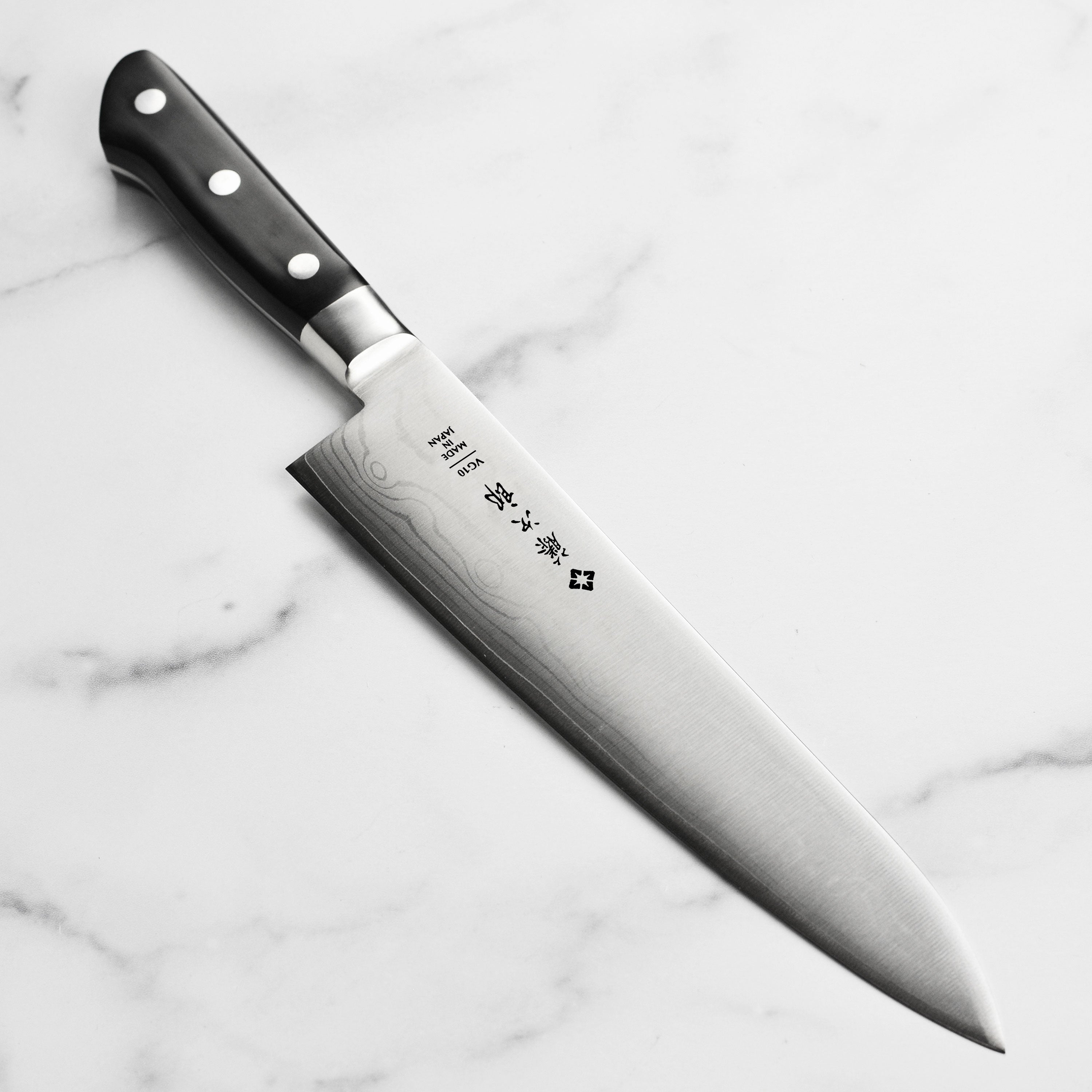 Damascus pattern on the blade of a Japanese kitchen knife