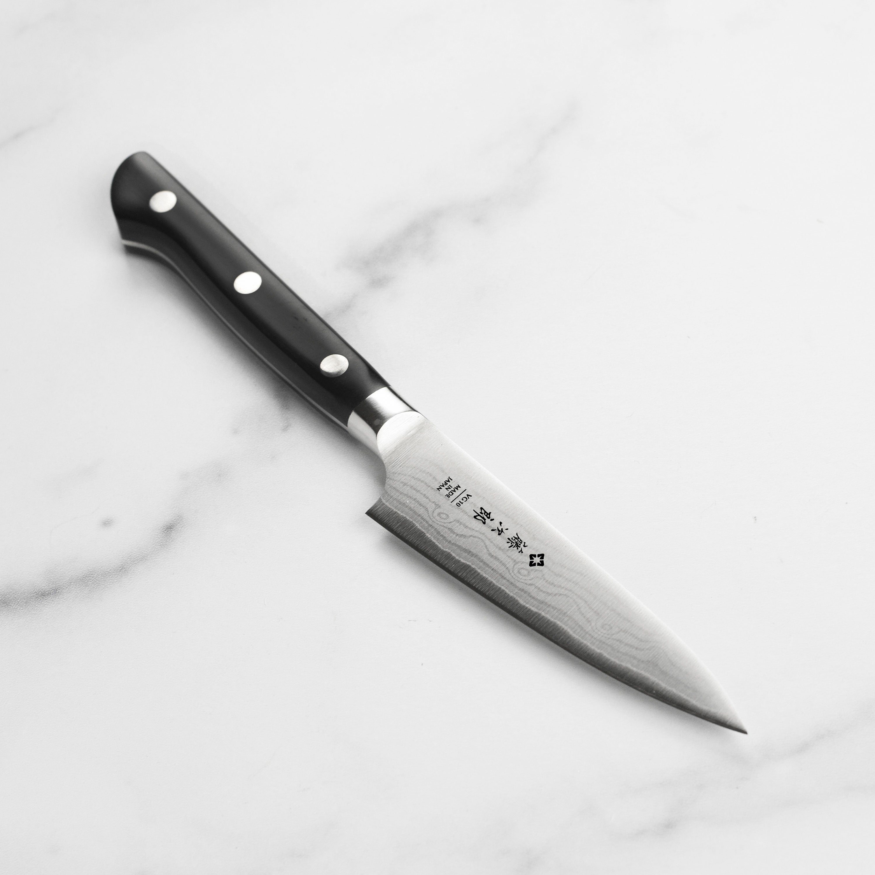 Tojiro Superior Damascus Paring Knife with stunning Damascus blade pattern, perfect for detailed kitchen work.