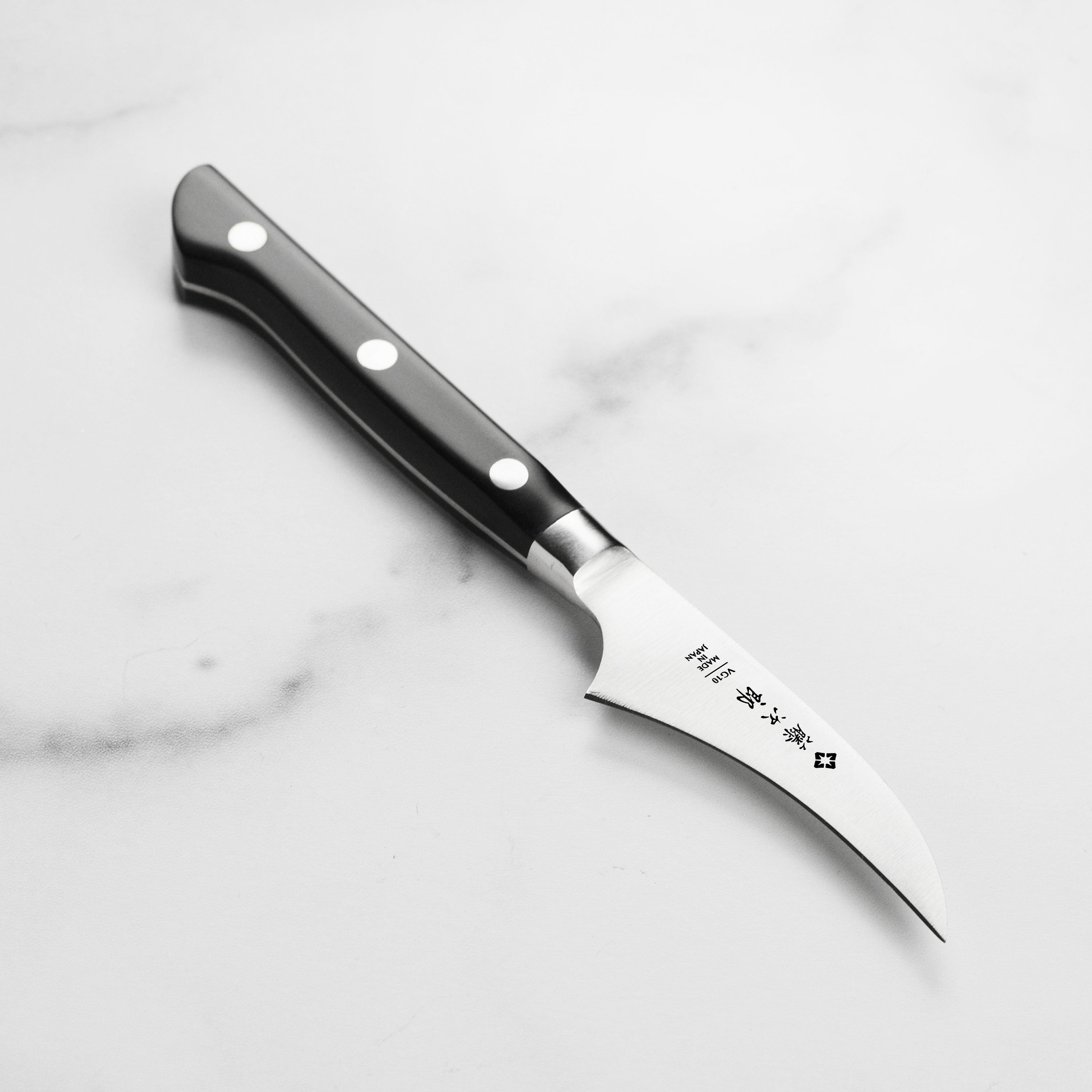 Japanese paring knife with VG-10 steel core and micarta handle for peeling tasks