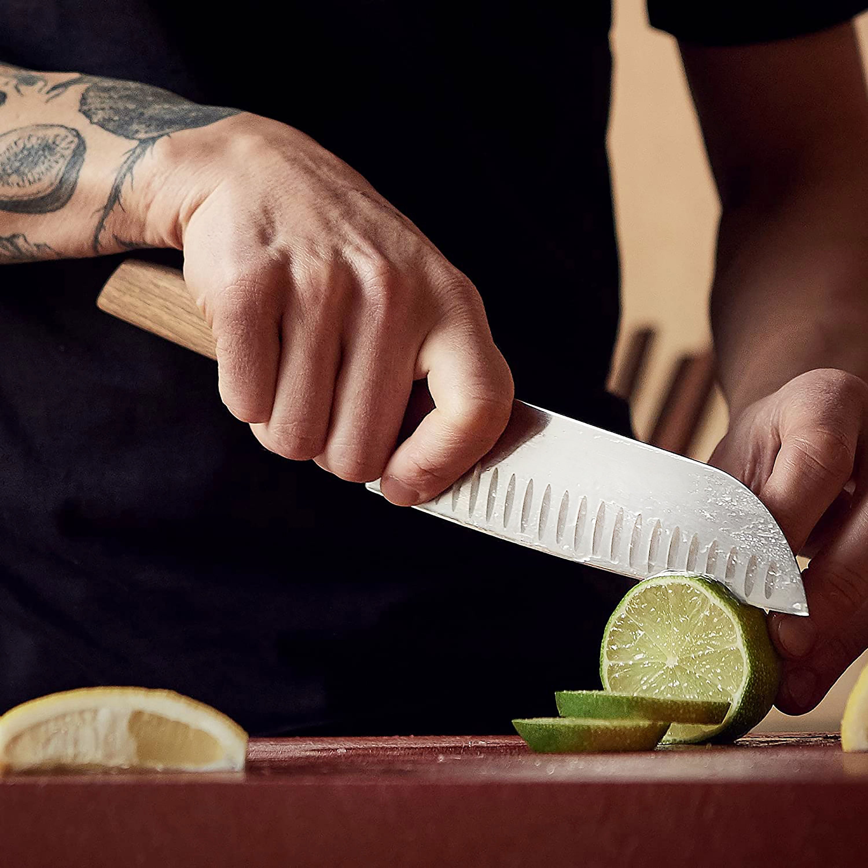 Victorinox Swiss Modern Santoku knife in a kitchen setting, demonstrating its perfect balance and ergonomic grip.