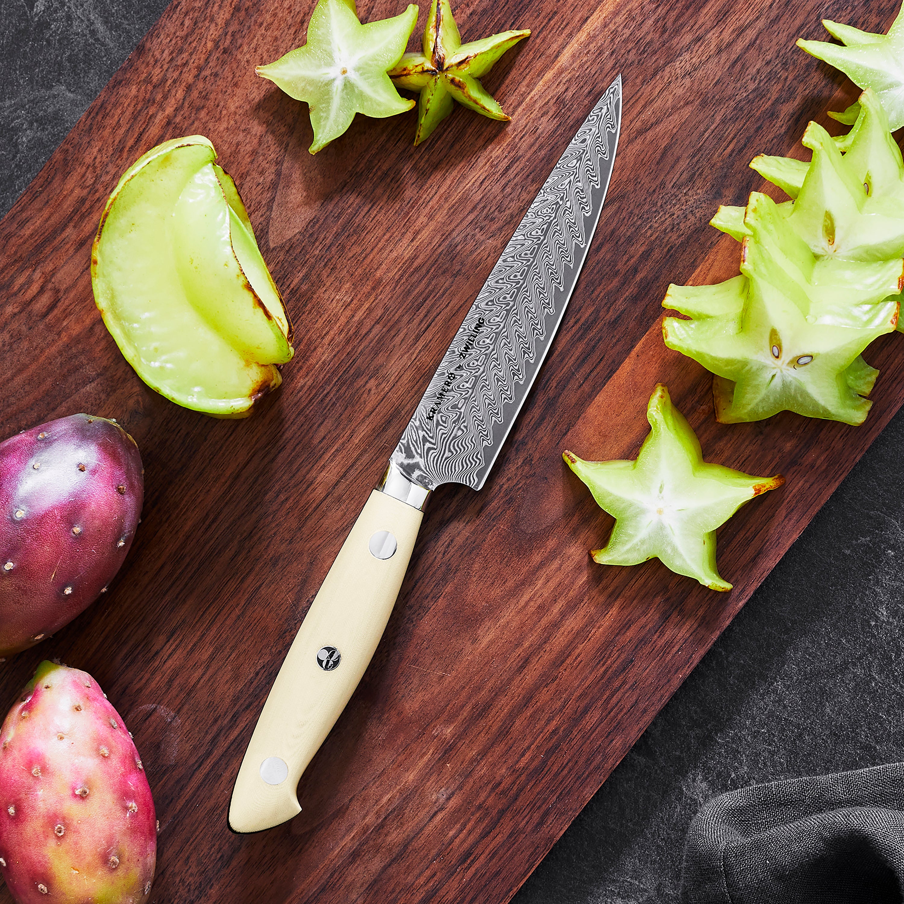 Japanese knife featuring 101-layer Damascus steel with chevron pattern for precision cutting