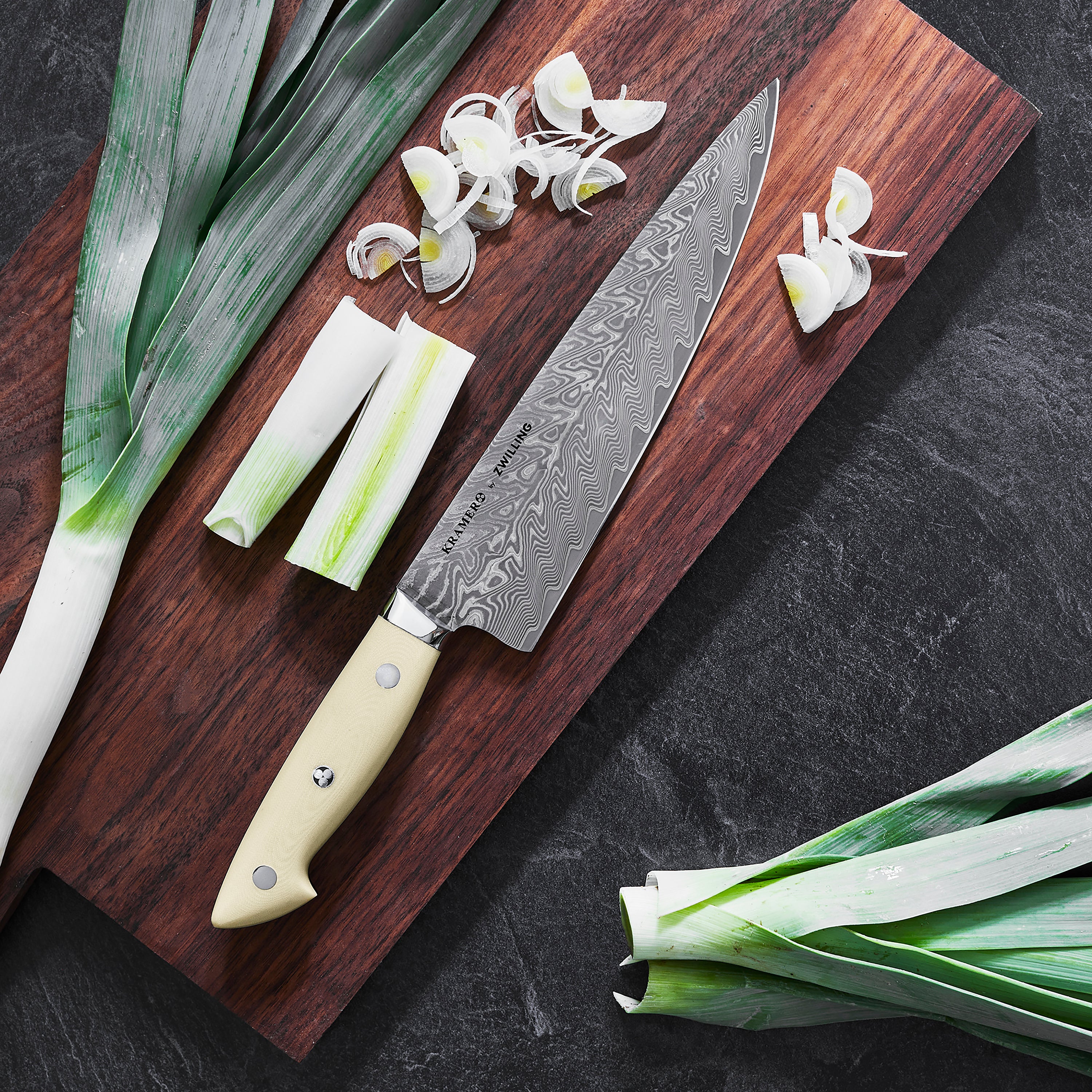 Display of the 7-piece luxury knife set on a wooden block with handles