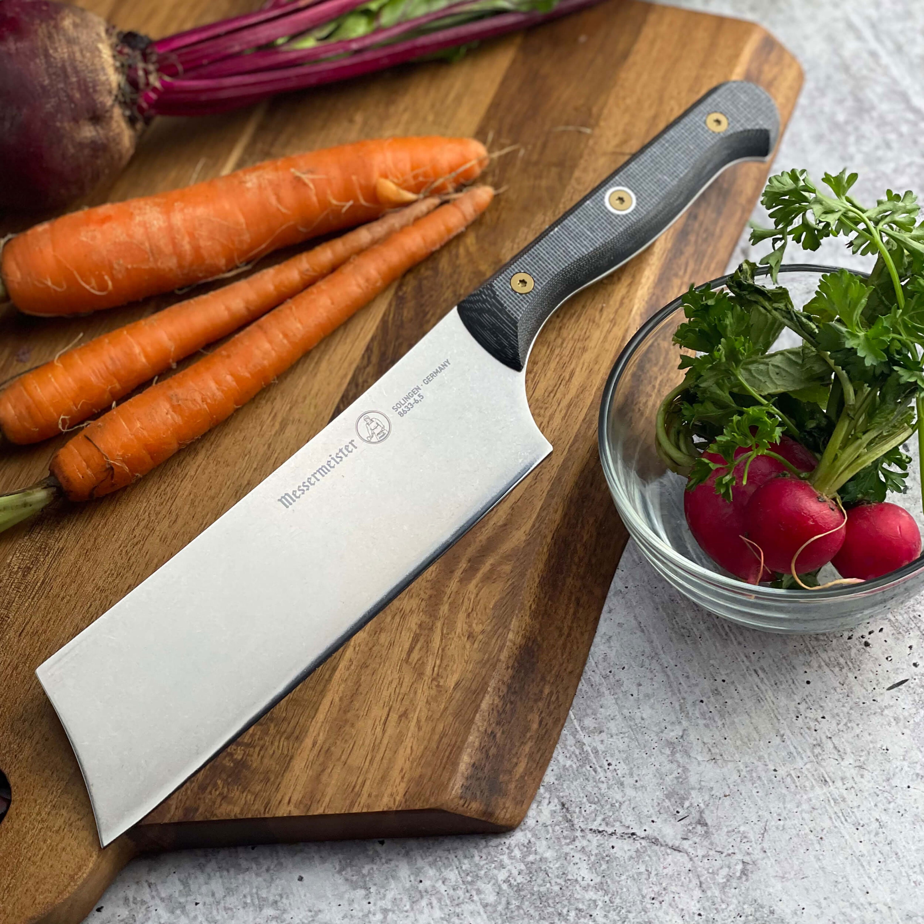 Close-up view of the Precision Micarta Nakiri Knife highlighting the blade and handle texture.