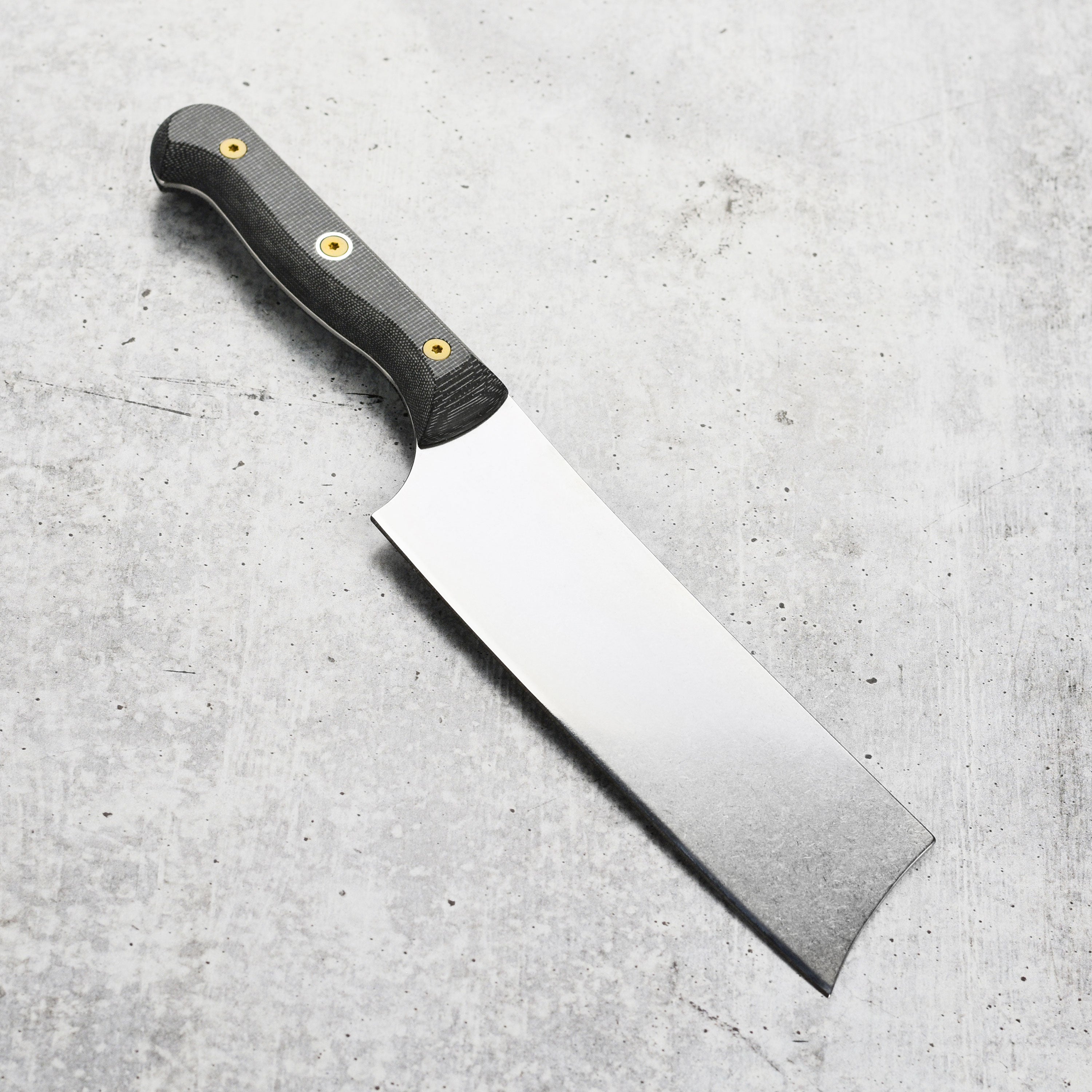 A side profile of the German kitchen knife demonstrating its balanced design and craftsmanship.
