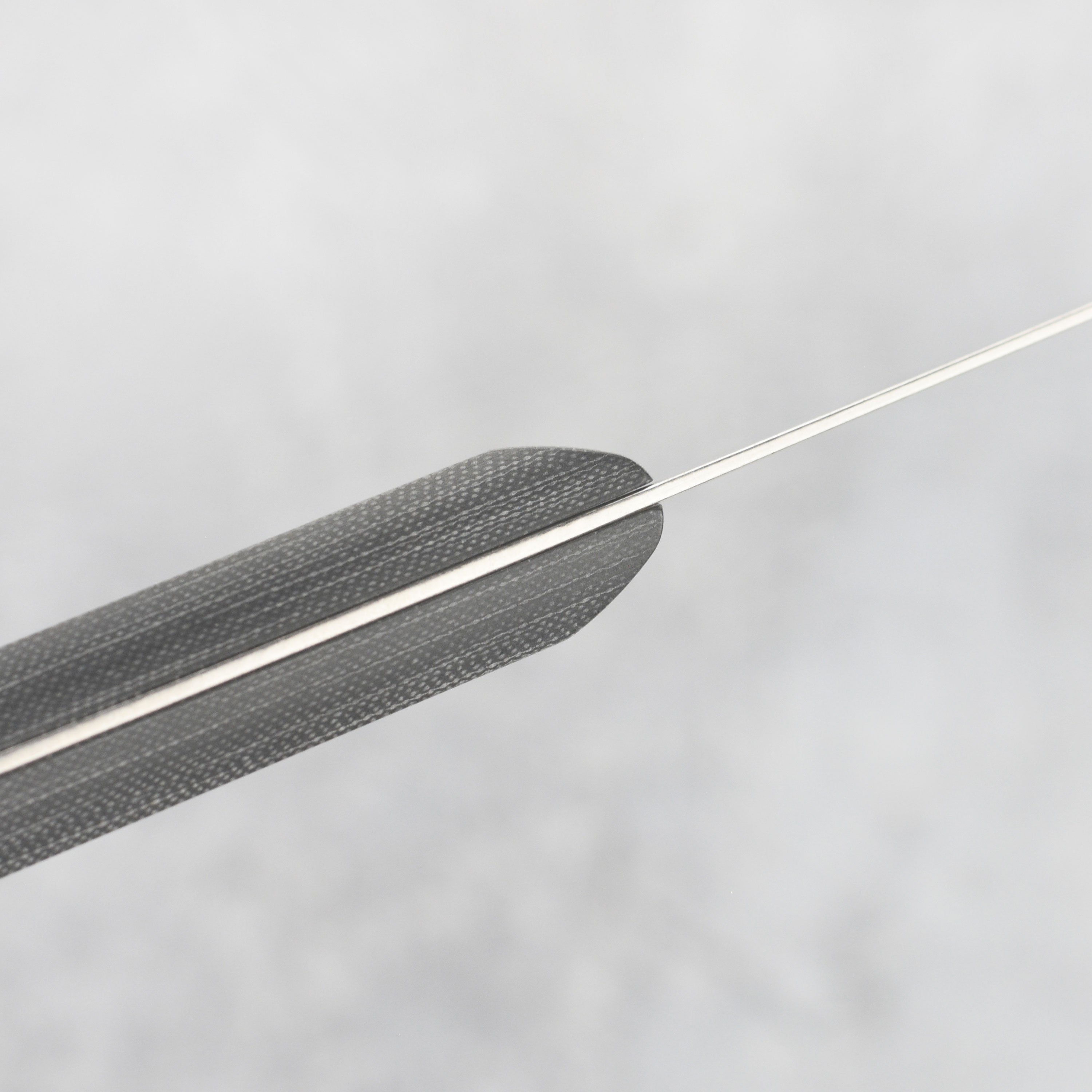 Side view of the Messermeister Micarta 3.5" paring knife displaying its unique ceramic stonewash finish.