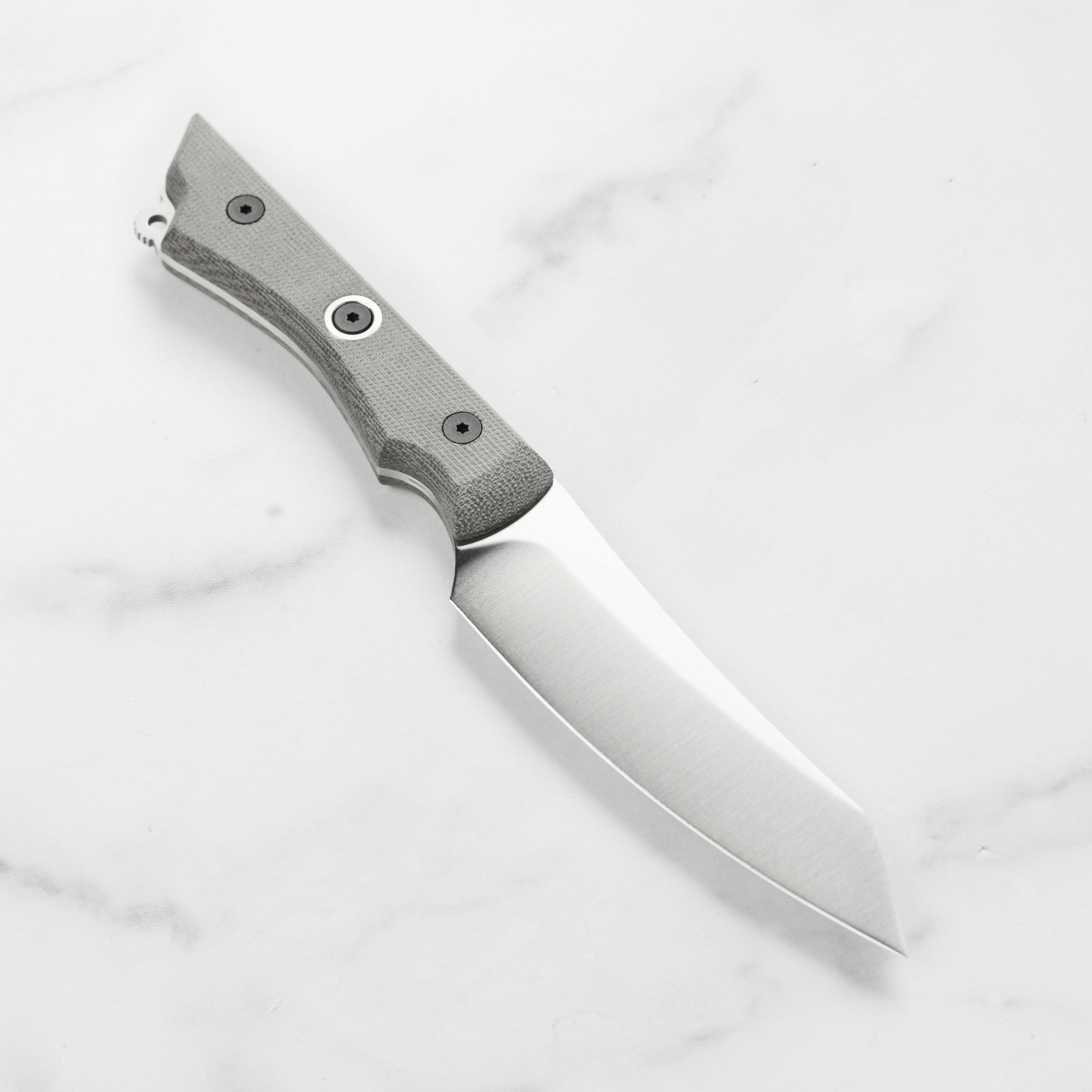 Close-up of the 4.5-inch utility knifes ballistic clip point blade