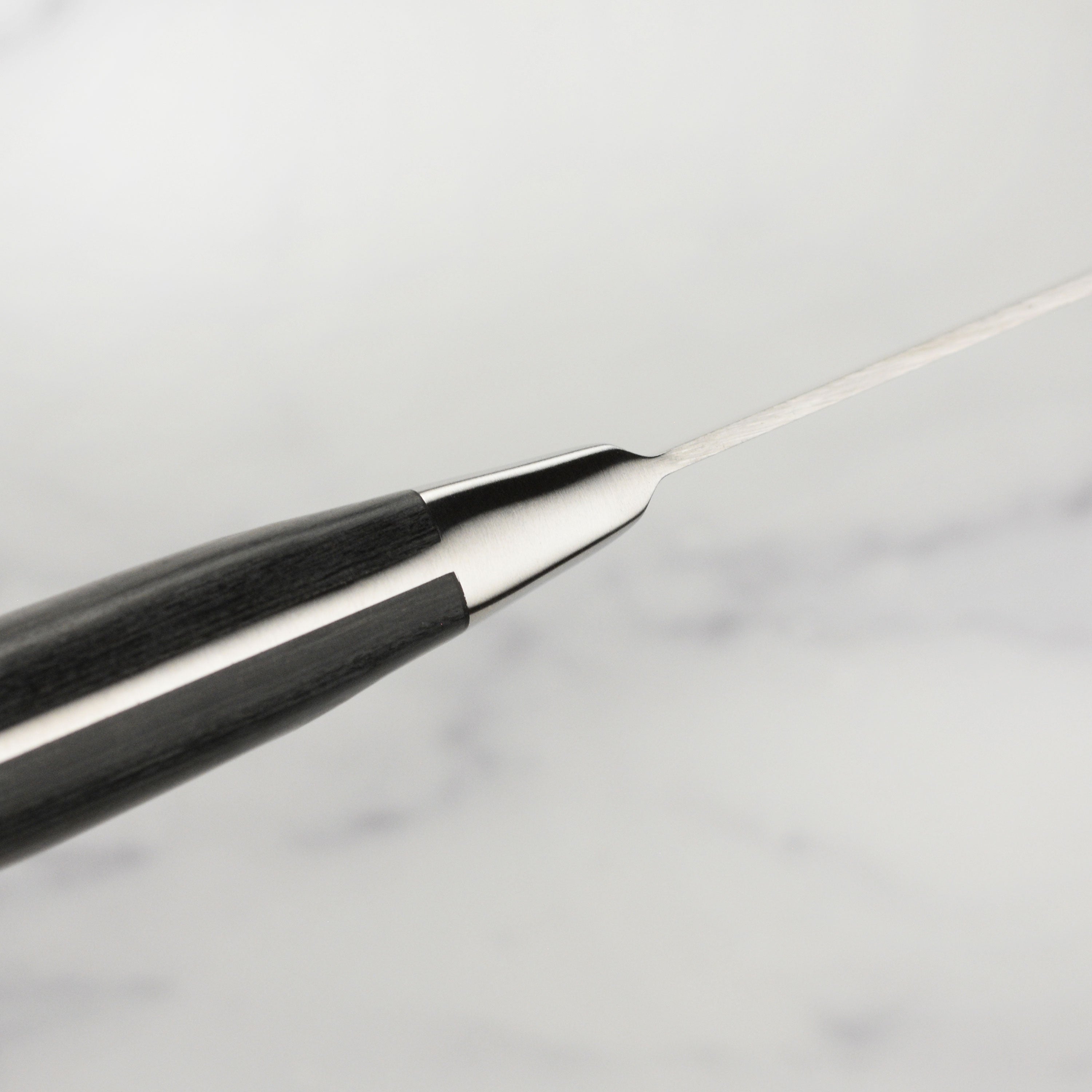 Close-up of Messermeister Avanta forged BBQ knife with pakkawood handle